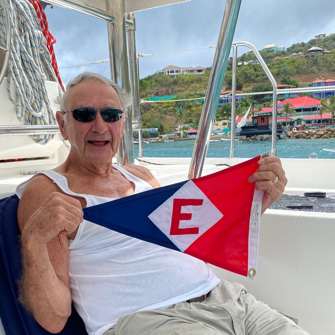  Dick happily hoists the EYC colors in Leverick Bay, British Virgin Islands 