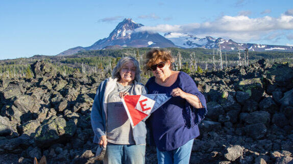  Kay Lee and Leta show their EYC pride at the Dee Wright Observatory at MacKenzie Pass 