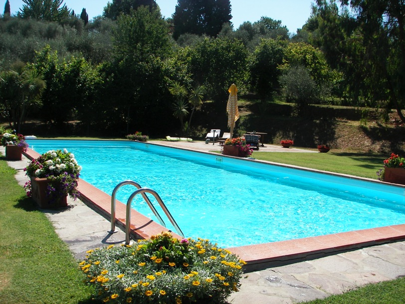 Pool area features a large adjustable umbrella and teak furniture. The pool water is tested and maintained twice weekly by our long-time gardener.