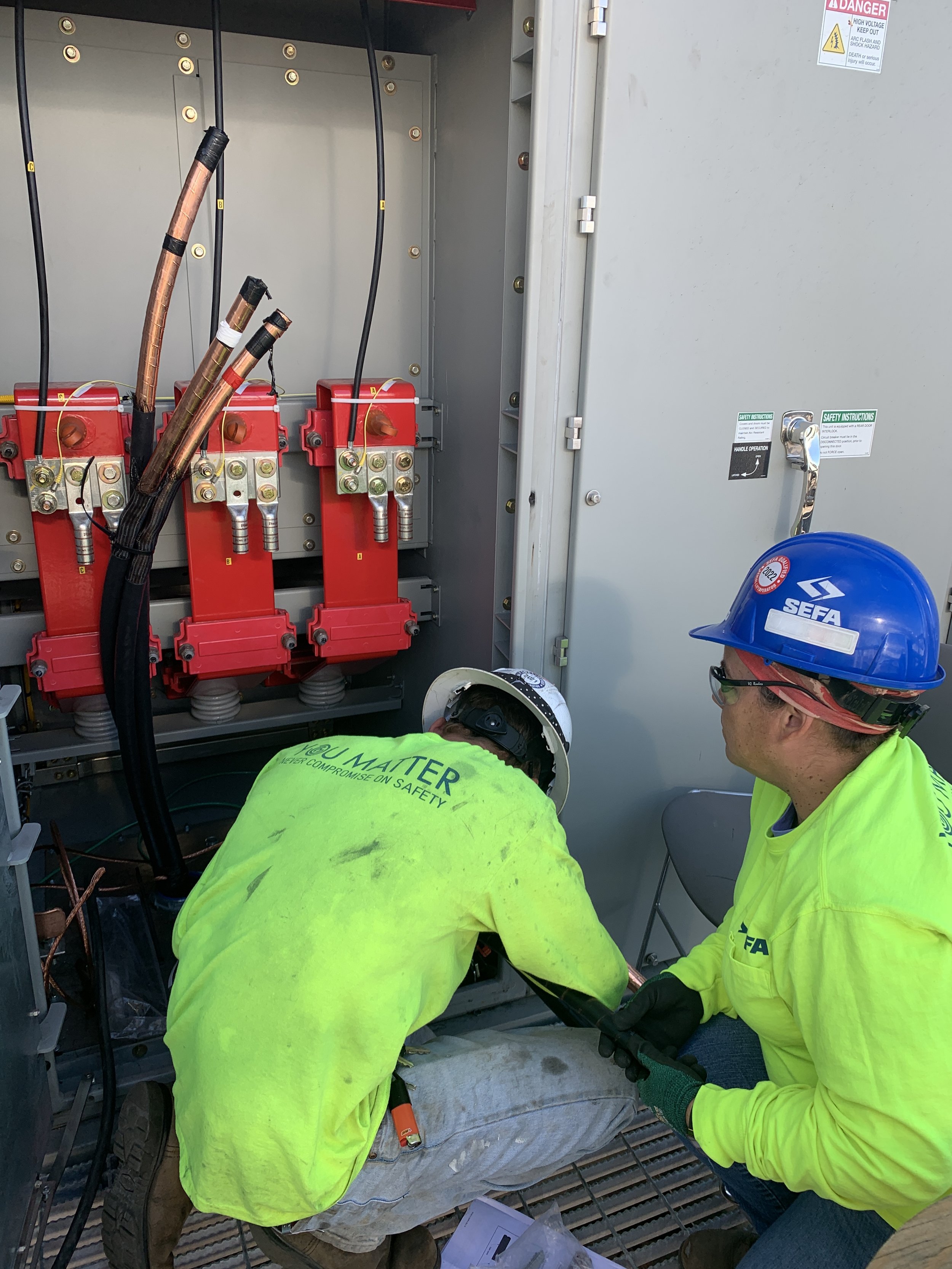  A certified installer completes the termination at the phase 1 medium voltage switchgear in the power distribution center. 