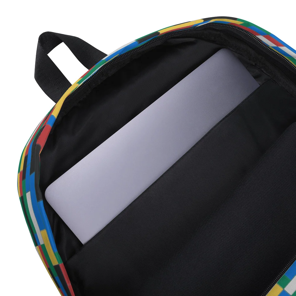Detail of the open Colorful Building Blocks Backpack, showing a laptop or tablet secured in the internal sleeve.