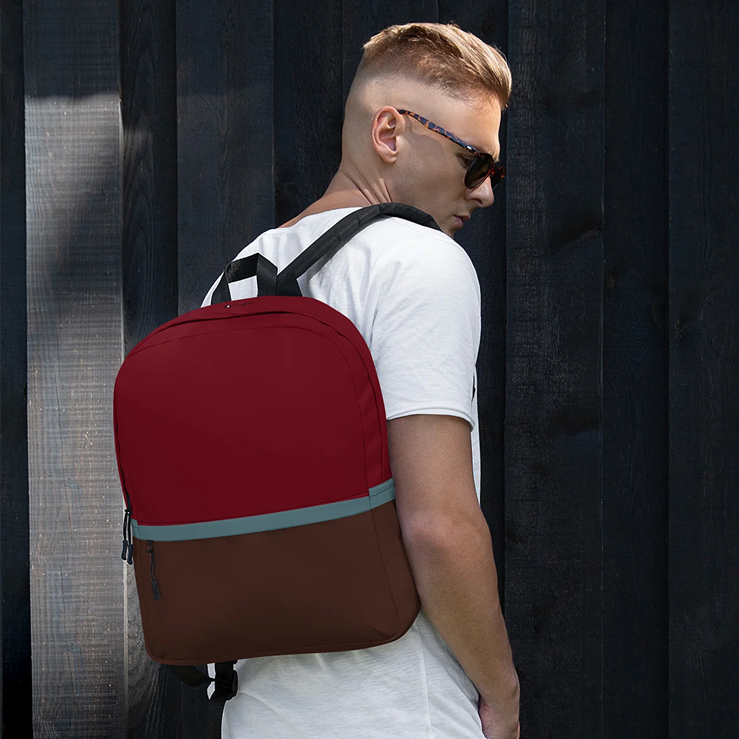 Man wearing the SoHo Urban Commuter Backpack, showing the fit and the rich maroon and brown colors against a dark background.