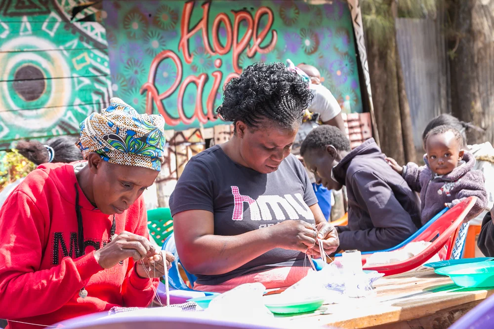 A women's beading collective working for Artisan Fashion in Nairobi, where MIMCO makes bags.