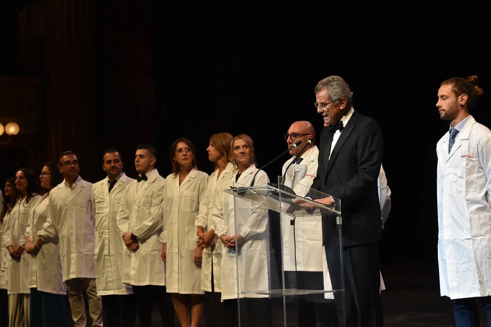 Men and women in white coats - the master cobblers of Ferragamo