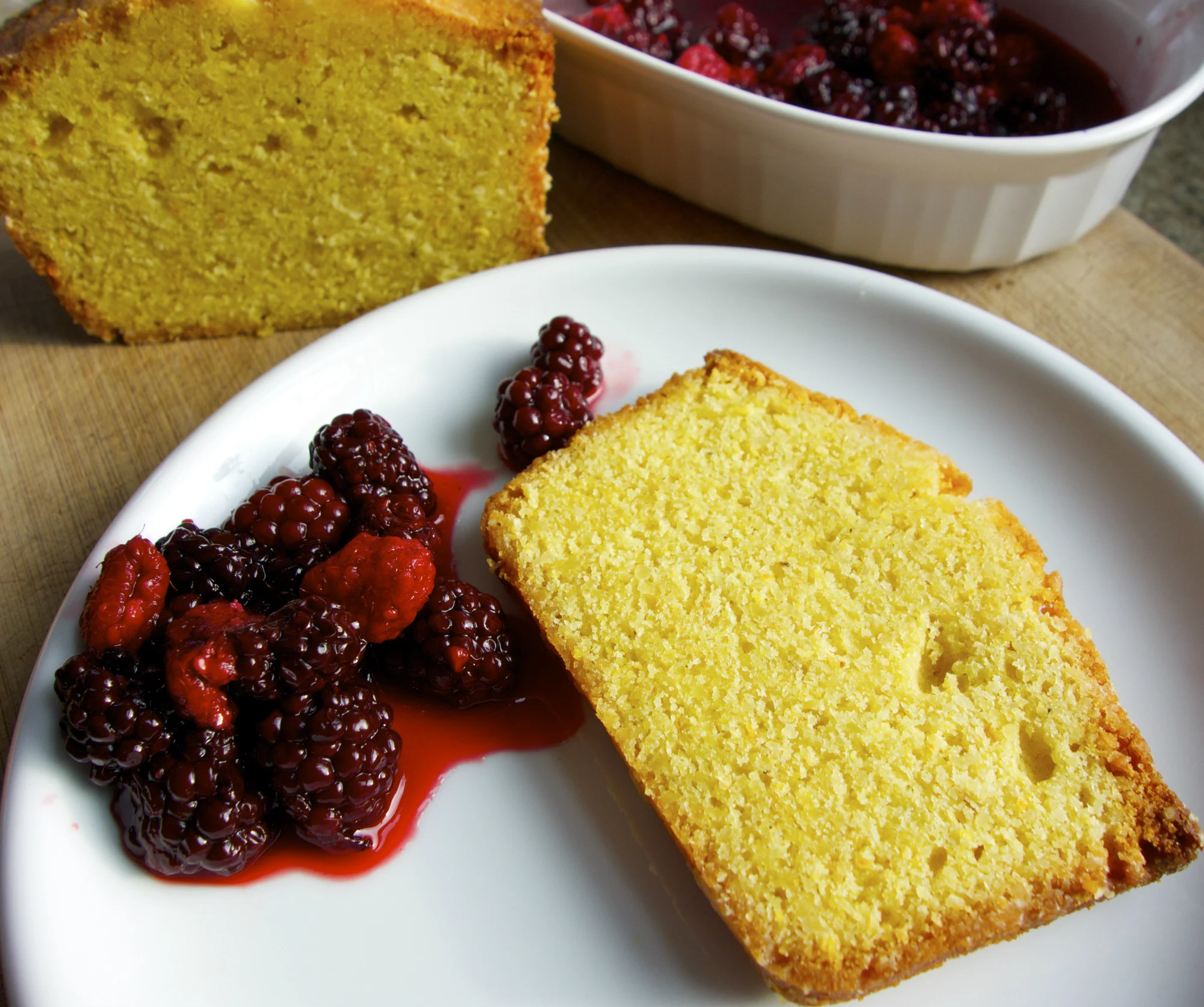 Most people buy cornmeal for cornbread, and there’s nothing wrong with that! But there are many desserts you can make with the delicious cornmeal we stone-grind from our organic white, yellow, and red corn. For either of these two recipes for “polenta poundcake,” we recommend using the finer “cornmeal” grind, but you may also use the coarser “polenta” grind for a more sandy texture. (Photo by Terra Brockman)