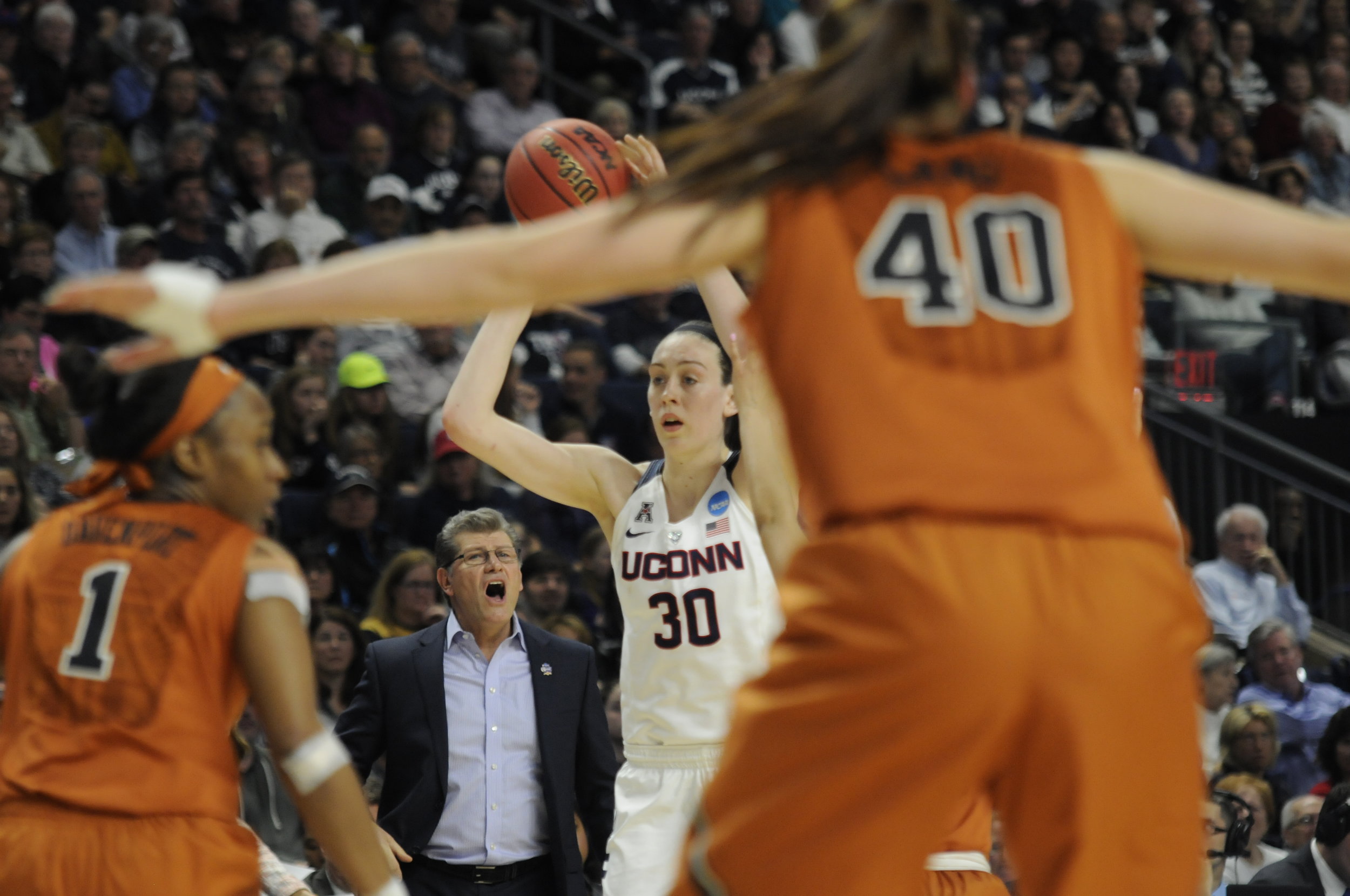  Connecticut forward Breanna Stewart (30) looks to pass the ball as head coach Geno Aurimemma calls out directions during an NCAA tournament quarterfinal game against Texas on March 28, 2016.&nbsp;Stewart finished with 21 points, 13 rebounds,&nbsp;&n