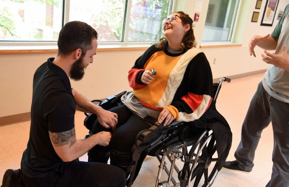  Wallingford native, Kayla Carbaugh, walks in an exoskeleton while recovering at Gaylord Hospital from a fall that left her partially paralyzed. 