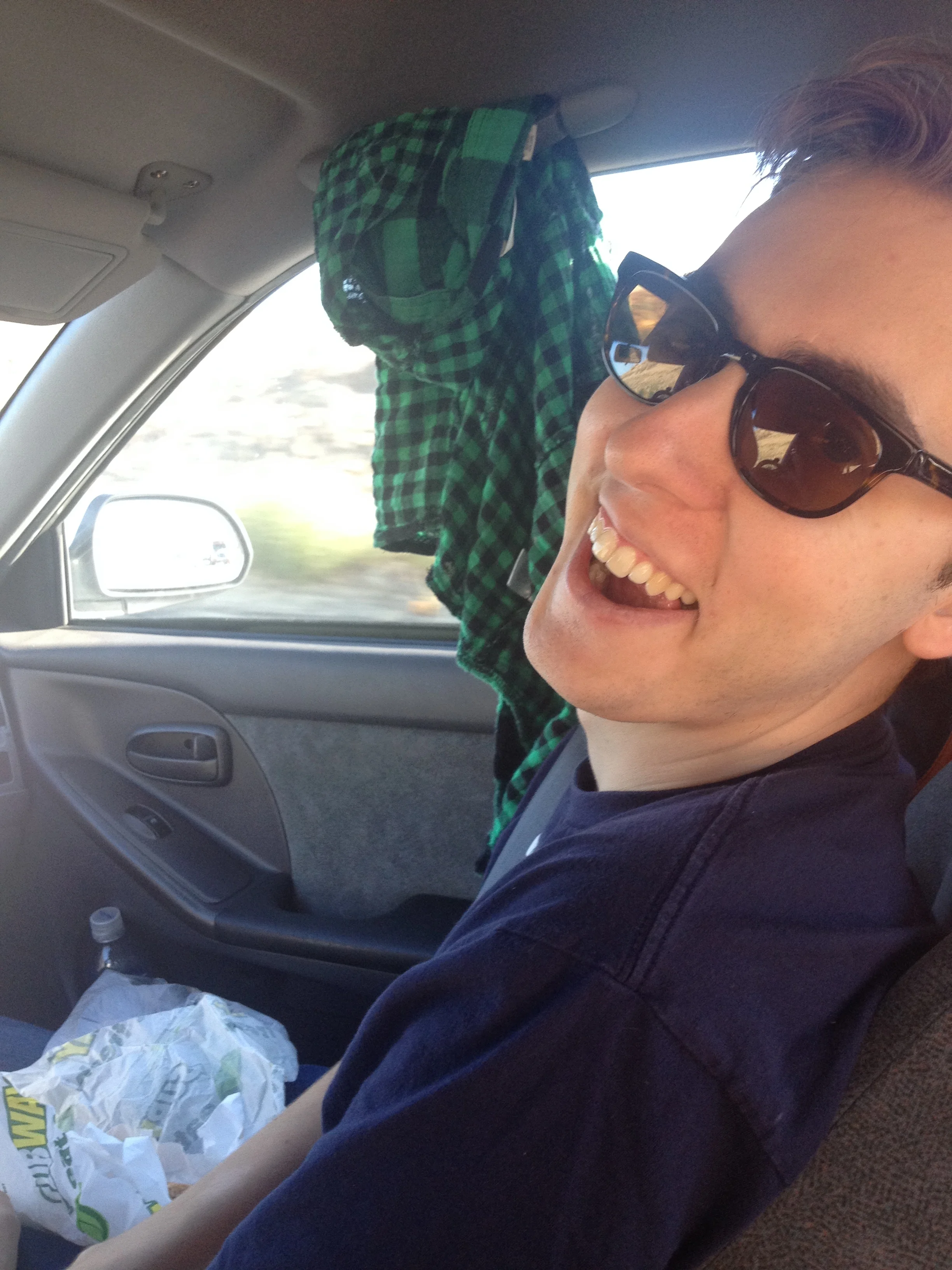Colin enjoying the trip (and subway sandwich apparently)