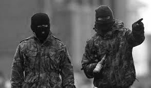 Irish Republican Army soldiers in balaclavas