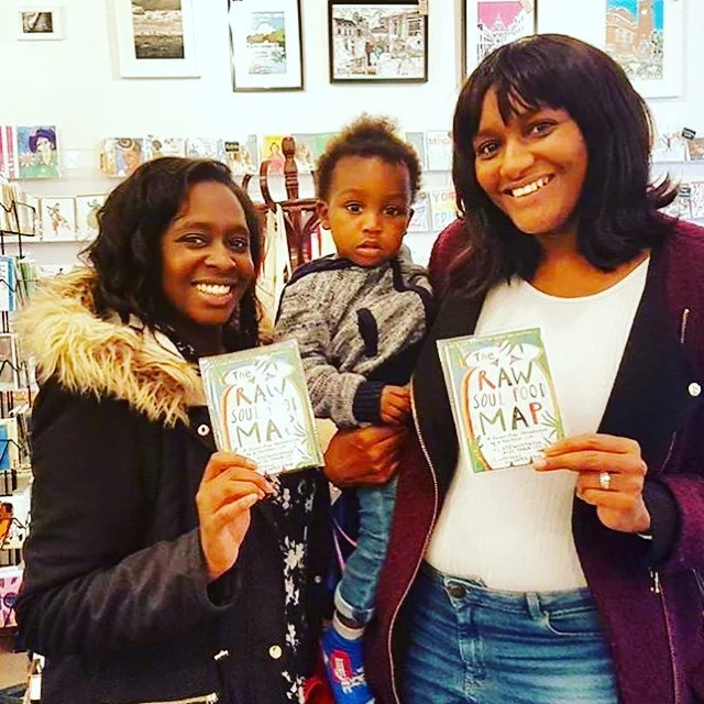 Siobhan, Nicole and baby Juwon get their The Raw Soul Food Map on Saturday at Diverse Gifts.