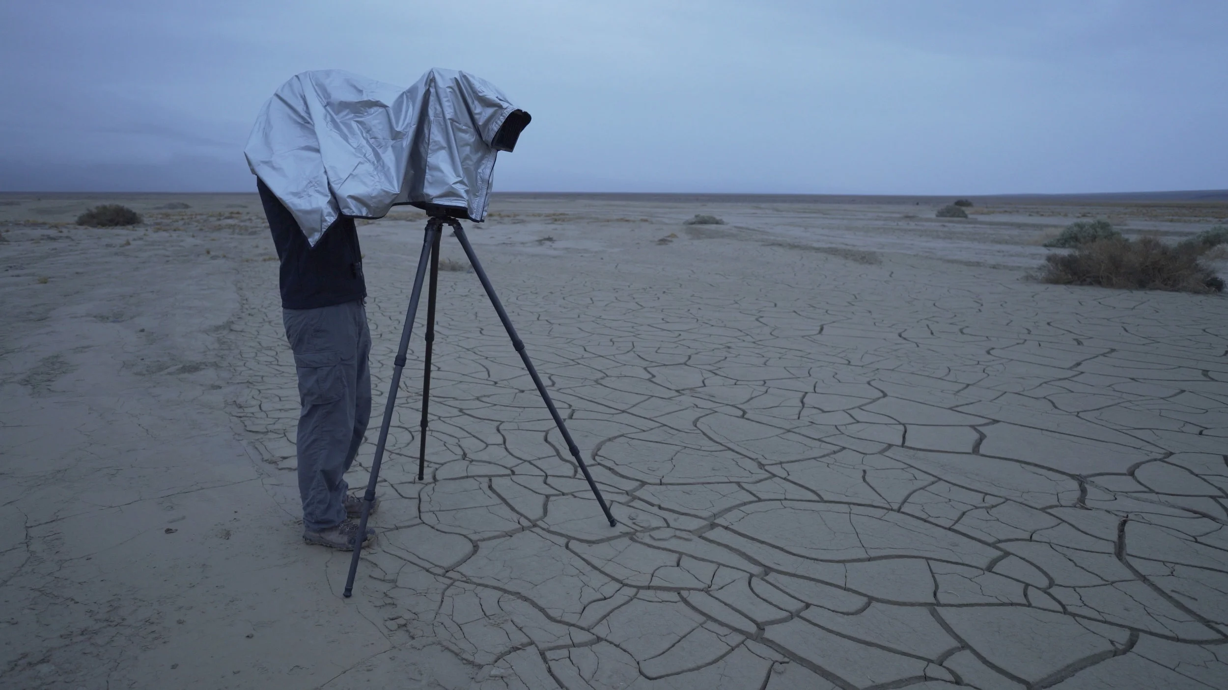 The Harrison Silver Classic Dark Cloth serves a double purpose, allowing you to fully operate your camera in the rain. In this photo, I am setting up my camera in a gentle rain before sunrise in Death Valley.