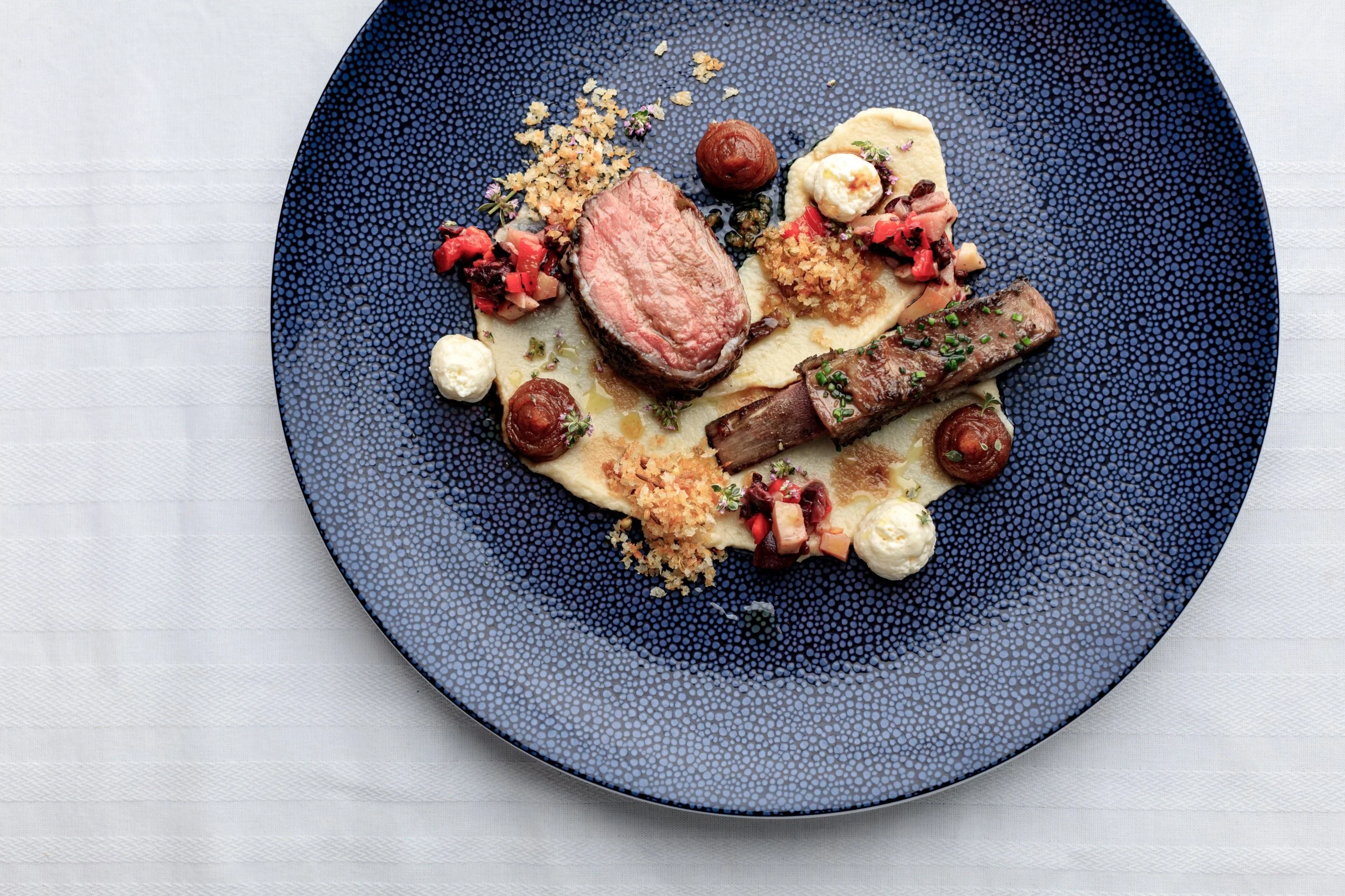 A dinner party dish of lamb fillet, with lamb breastt