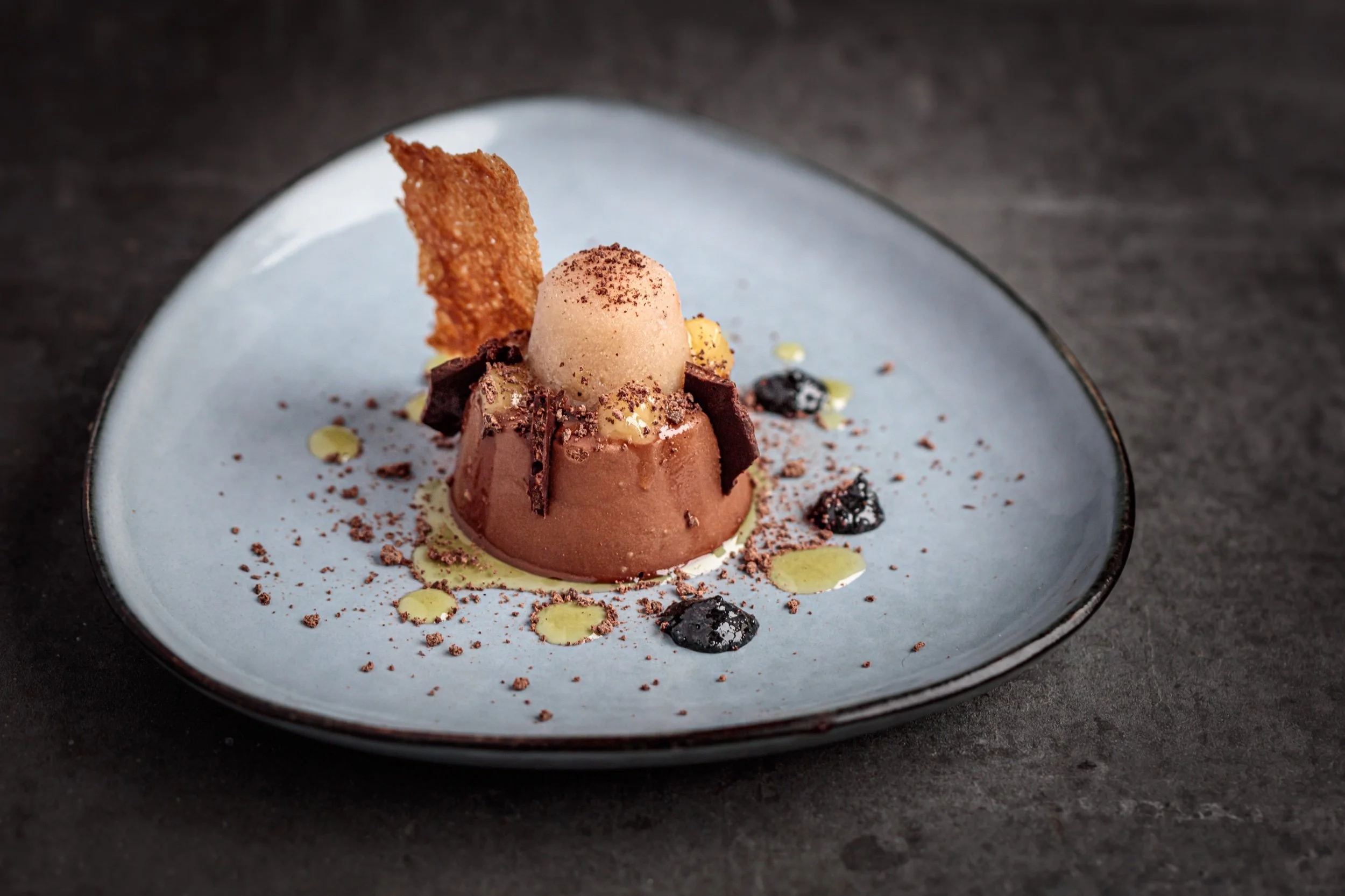 Chocolate and tahini cremeux, yuzu gel, roast banana sorbet, black sesame purée