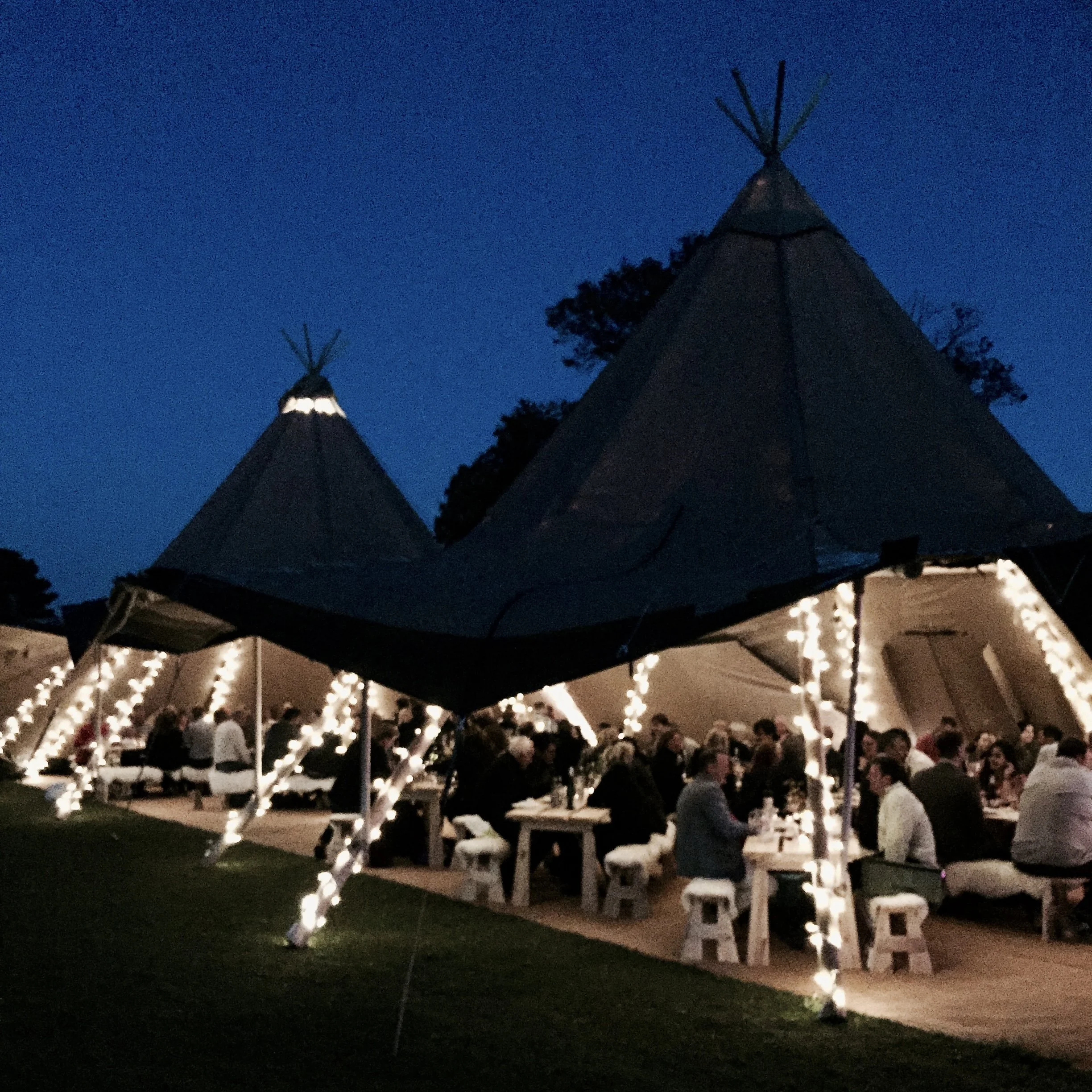 people dining at a tipi event