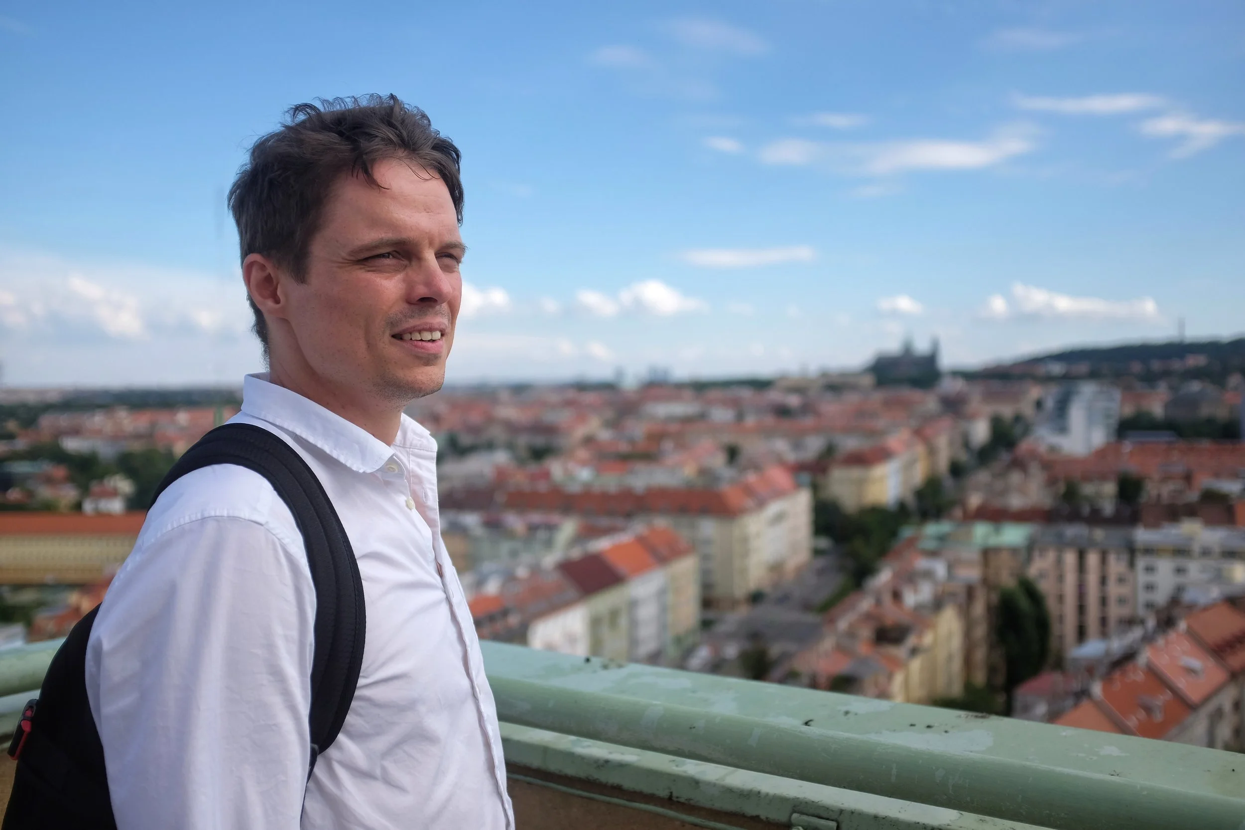 New manager of the International Hotel in Prague. Hotel International in Prague was opened in 1957 and was considered the city's first skyscraper (at 67m). It is built in the style of social realism after the model of Warsaw's Palace of Culture and Science, and Moscow's Lomonosov University. There is a balcony underneath the Soviet Star at it's top, that is closed for visits. Unless you are lucky, that is. The new manager of the hotel is pictured here on that balcony.