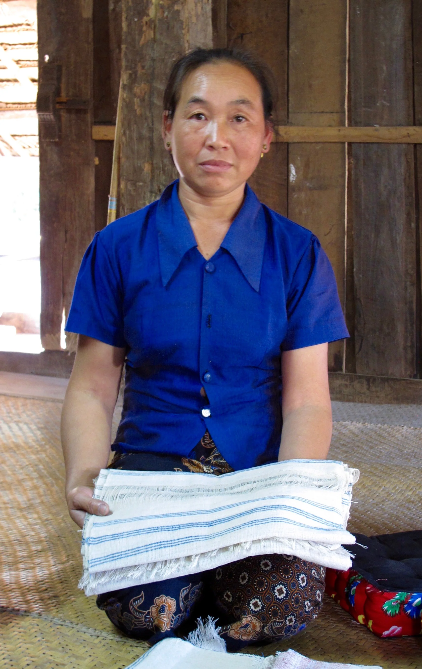 Panya with her delicately handwoven napkins