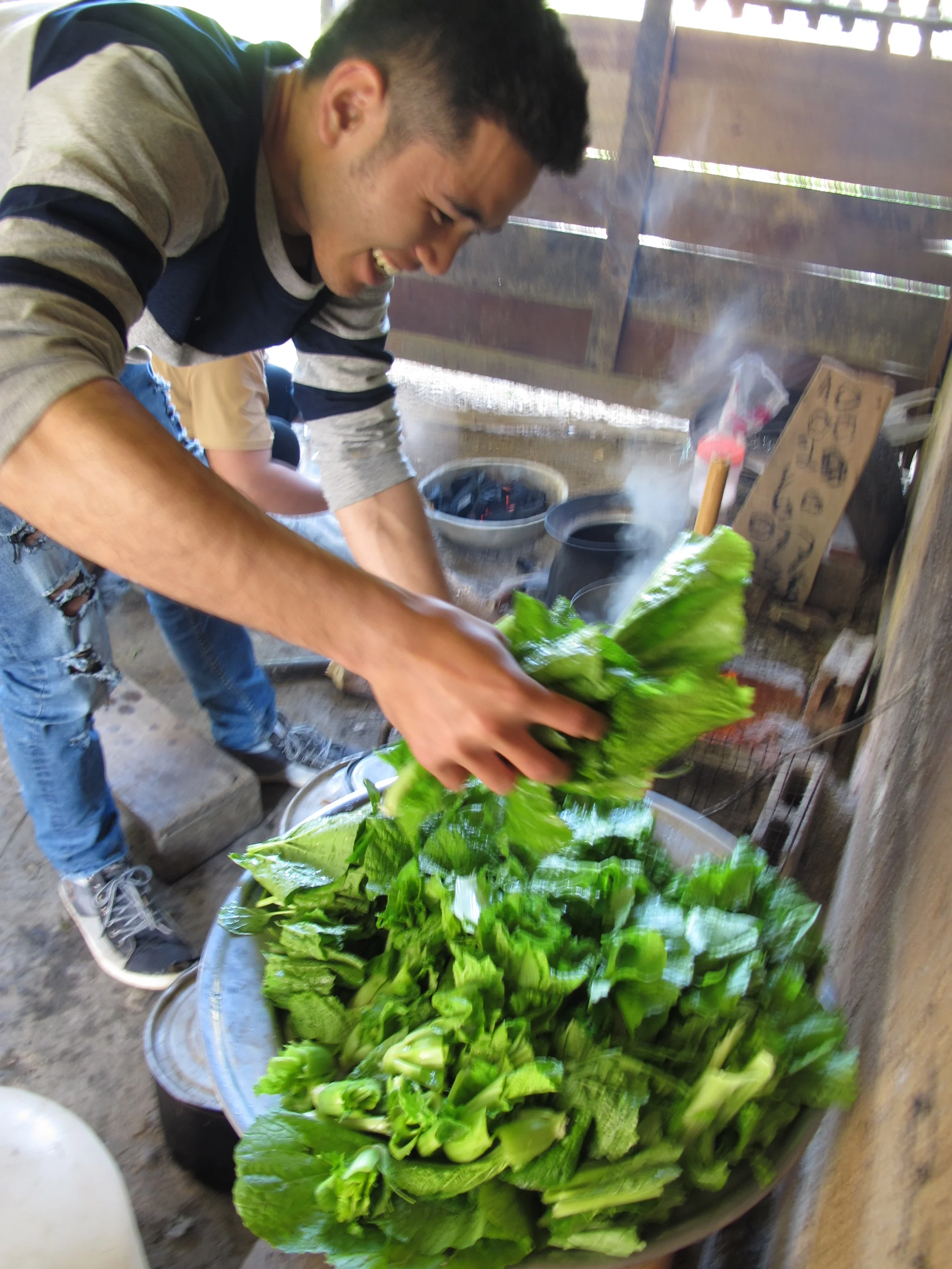 Sin boiling the leafy greens in lemongrass and garlic