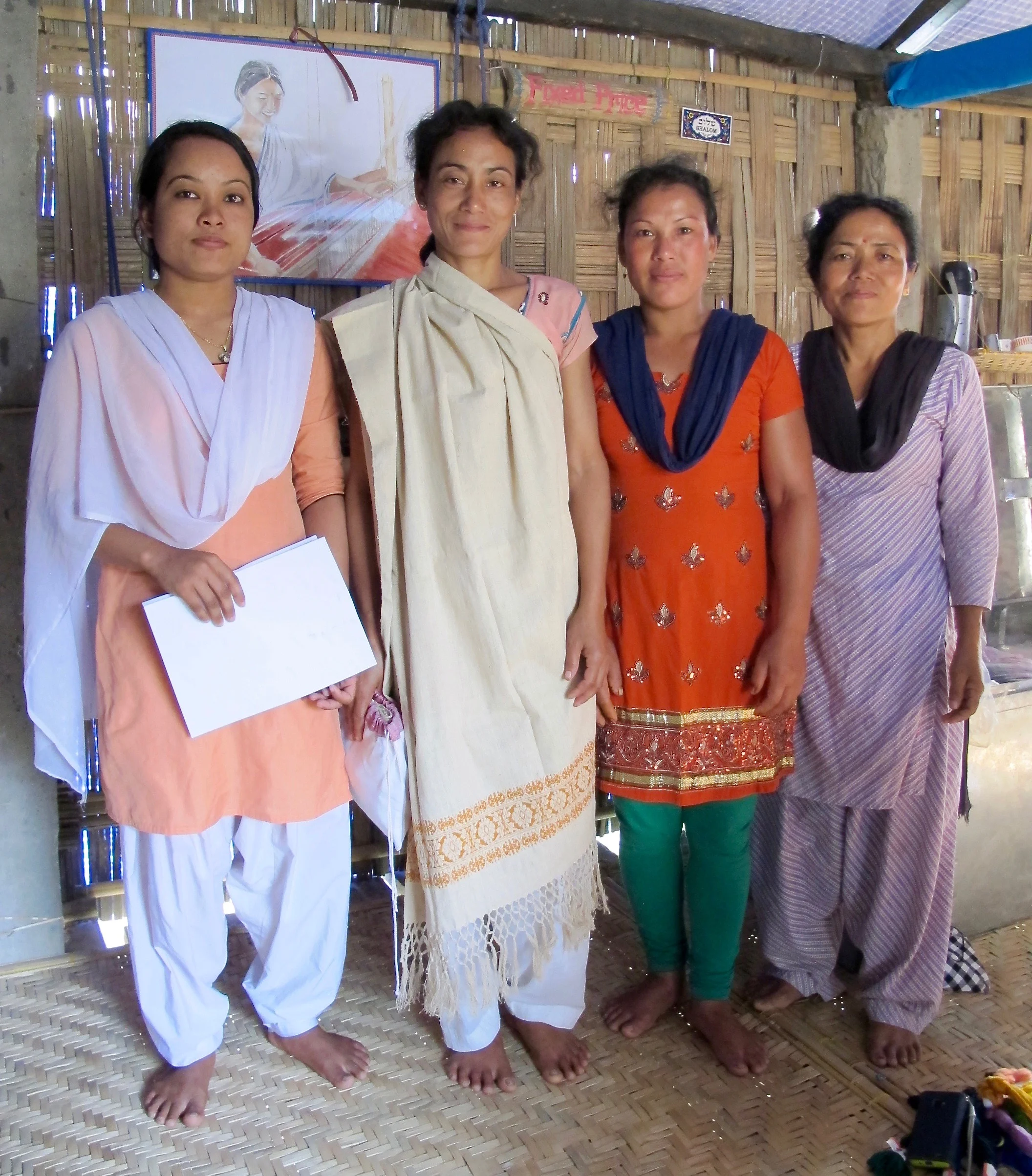Not only has the artisan cooperative become a source of skills training and income for the women, it has provided a platform for emerging women leaders and collective action. Weaver Jan Moni, second from left, draping the handwoven and hand dyed stole she made from Assamese Eri raw silk.