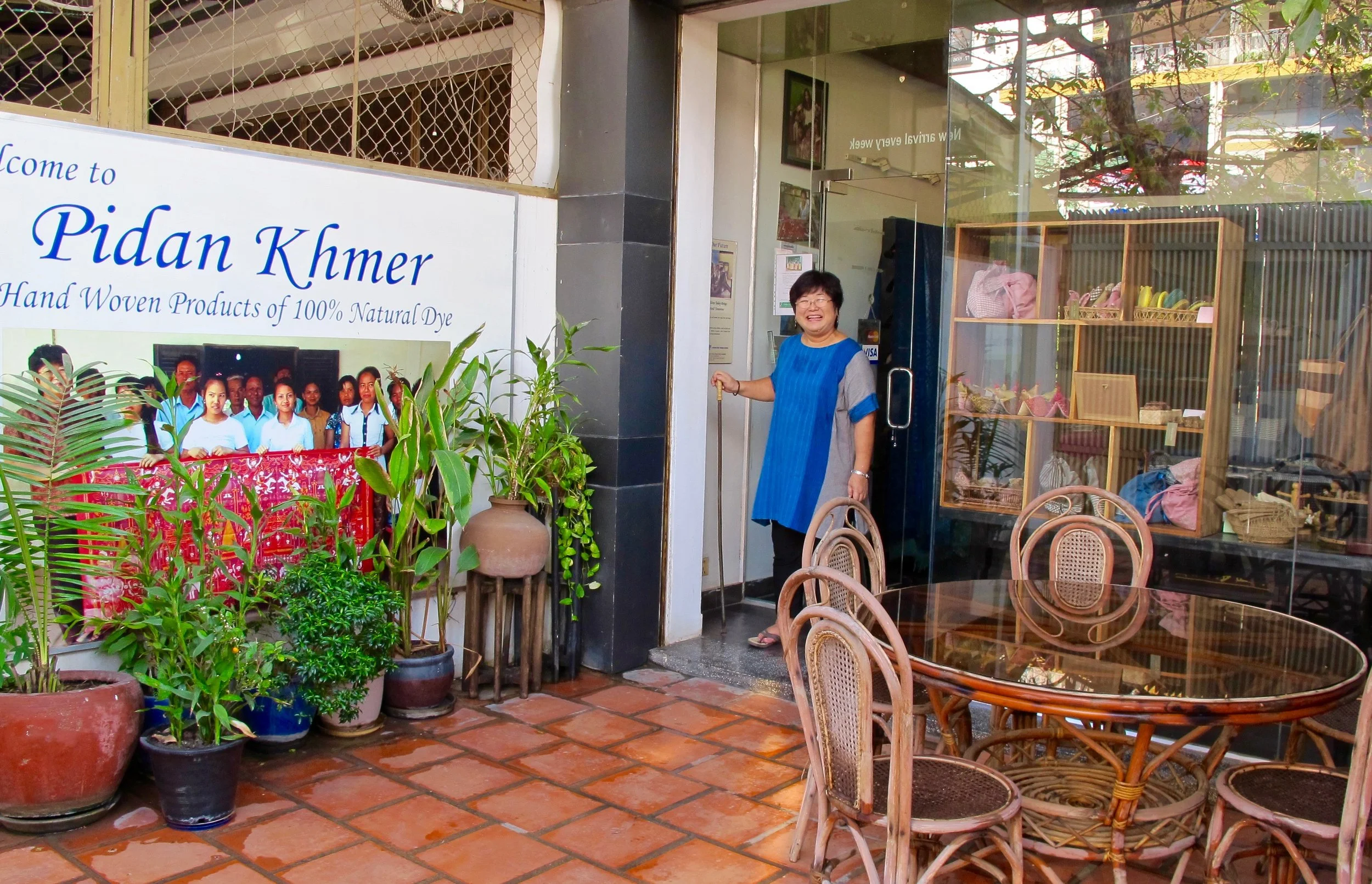 Harumi Sekiguchi in front of the Pidan Khmer / CYK shop in Phnom Penh