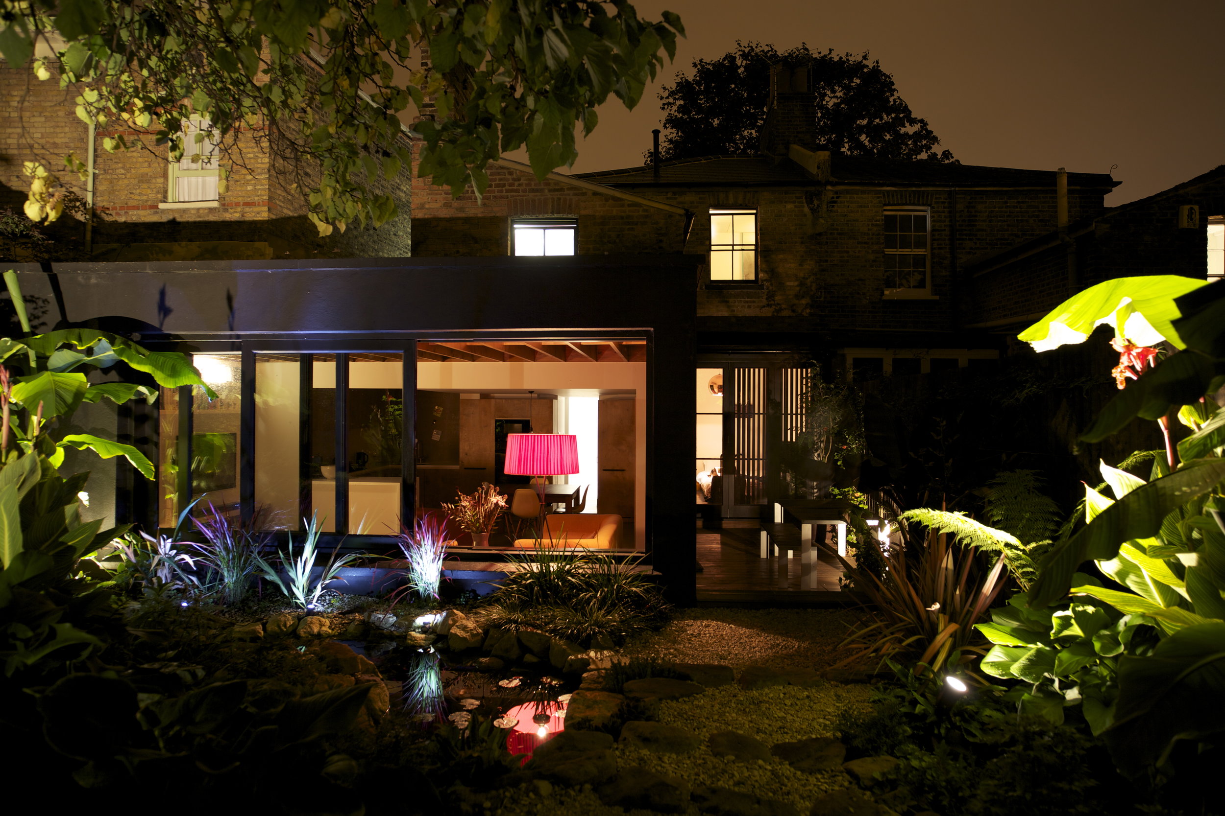 Large sliding hardwood windows and doors open to the rear, making the garden an integrated element of the home, highly visible all year round, illuminated at night and an extension of the living space in the warmer months. 