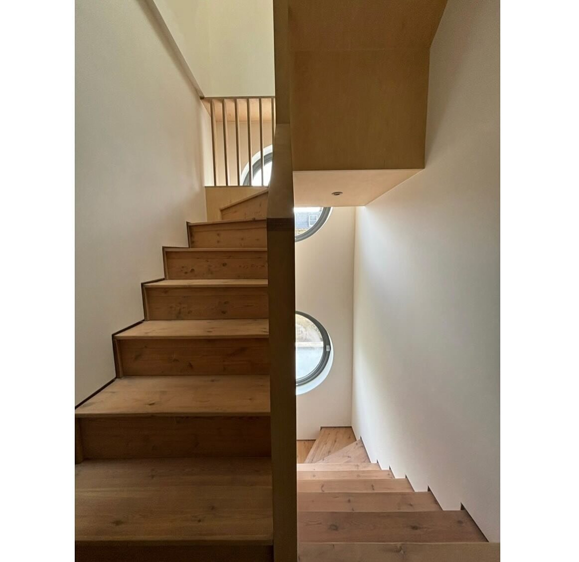Plywood stair and portholes at our arch house. #modernhome #modernstair