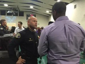 San Jose Police Chief Eddie Garcia talks with a resident at the third "Coffee with a Cop" event, held Sunday July 31, 2016 at the Emmanuel Baptist Church in North San Jose. (Eric Kurhi )