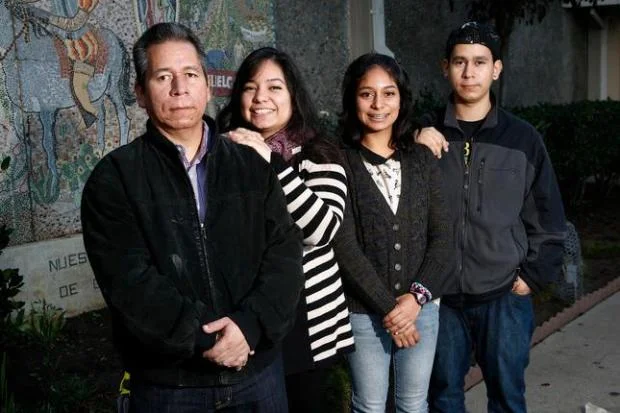 Ernesto Perez and his family in front of Our Lady of Guadalupe Church in San Jose, in 2014. Standing left to right is Ernesto Perez, daughters, Angela, Edith and son Max. (Gary Reyes/Bay Area News Group) 