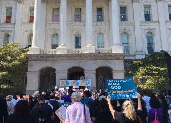Supporters of police-reform bills AB 931 and SB 1241 gather at the state Capitol on Aug. 13, 2018 during a ‘Day of Action’ to voice their support for the bills aimed at restricting police use of deadly force and open up officer conduct histories to heavier public scrutiny. (People Acting in Community Together)