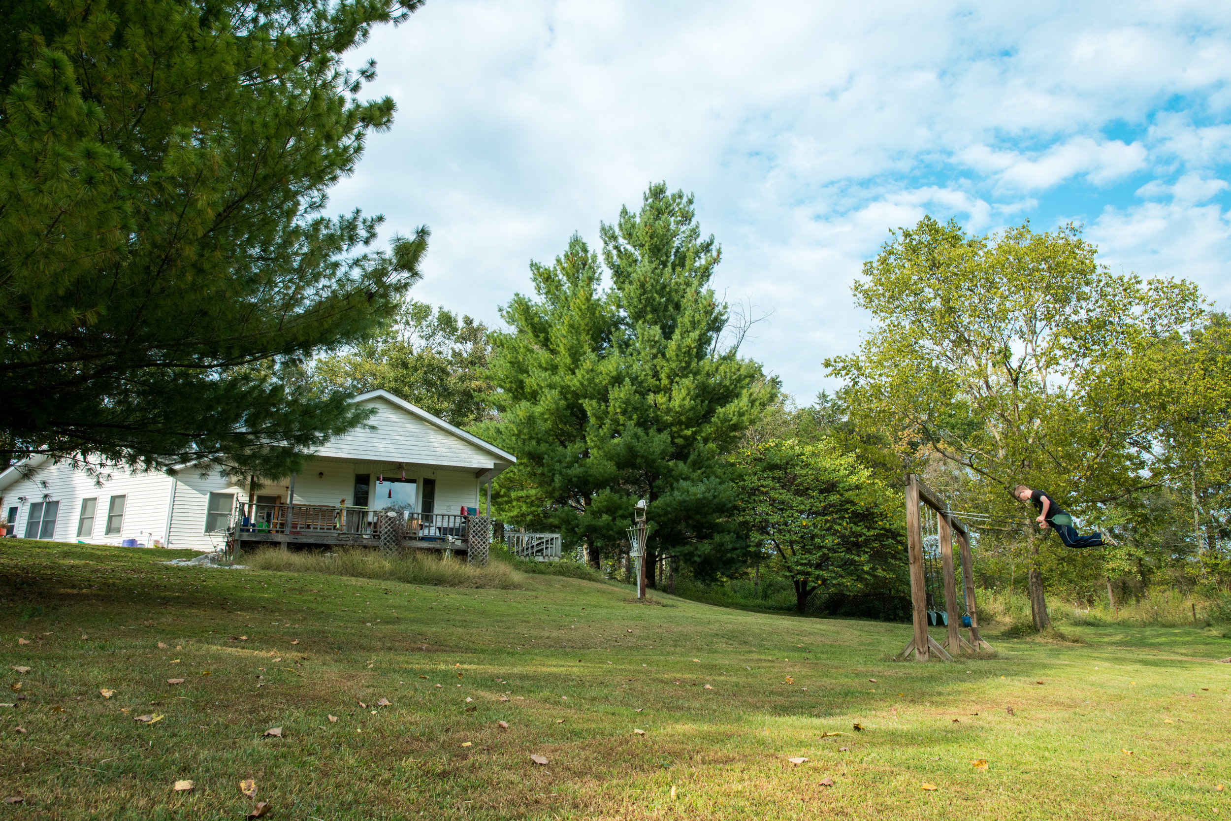  After school, Luke swings in the backyard.&nbsp; 