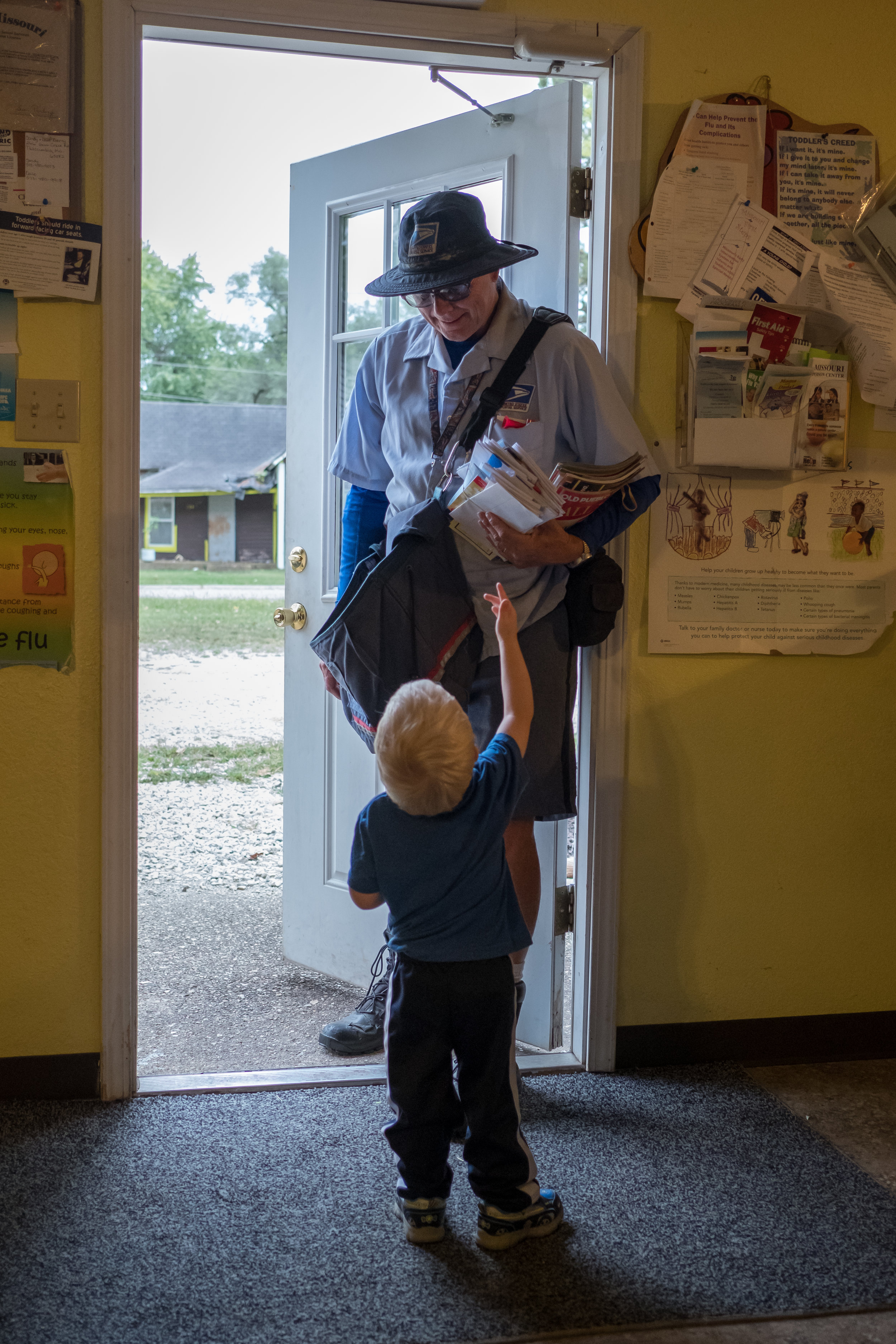  The children at a local day care center take turns getting the mail from Greg.&nbsp; 