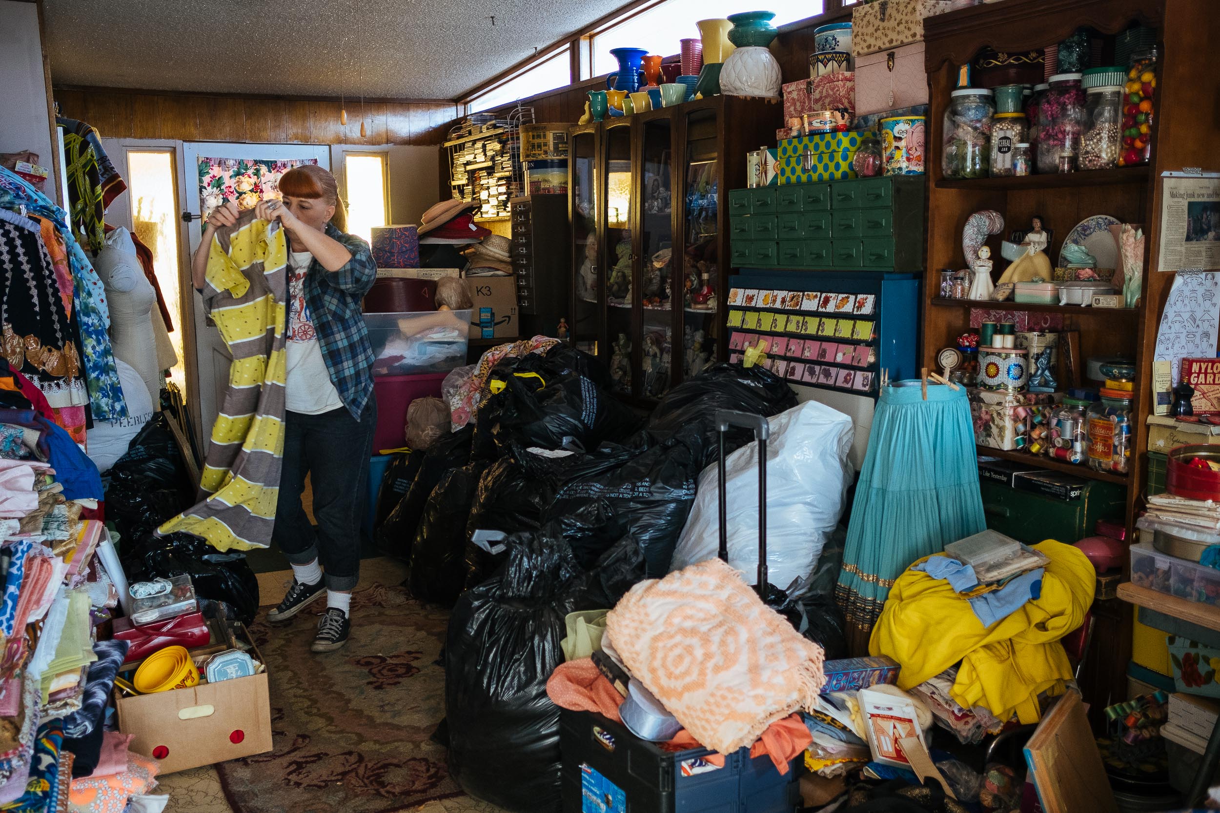 In her storeroom, Jenny locates a dress she sold on a Facebook group. 