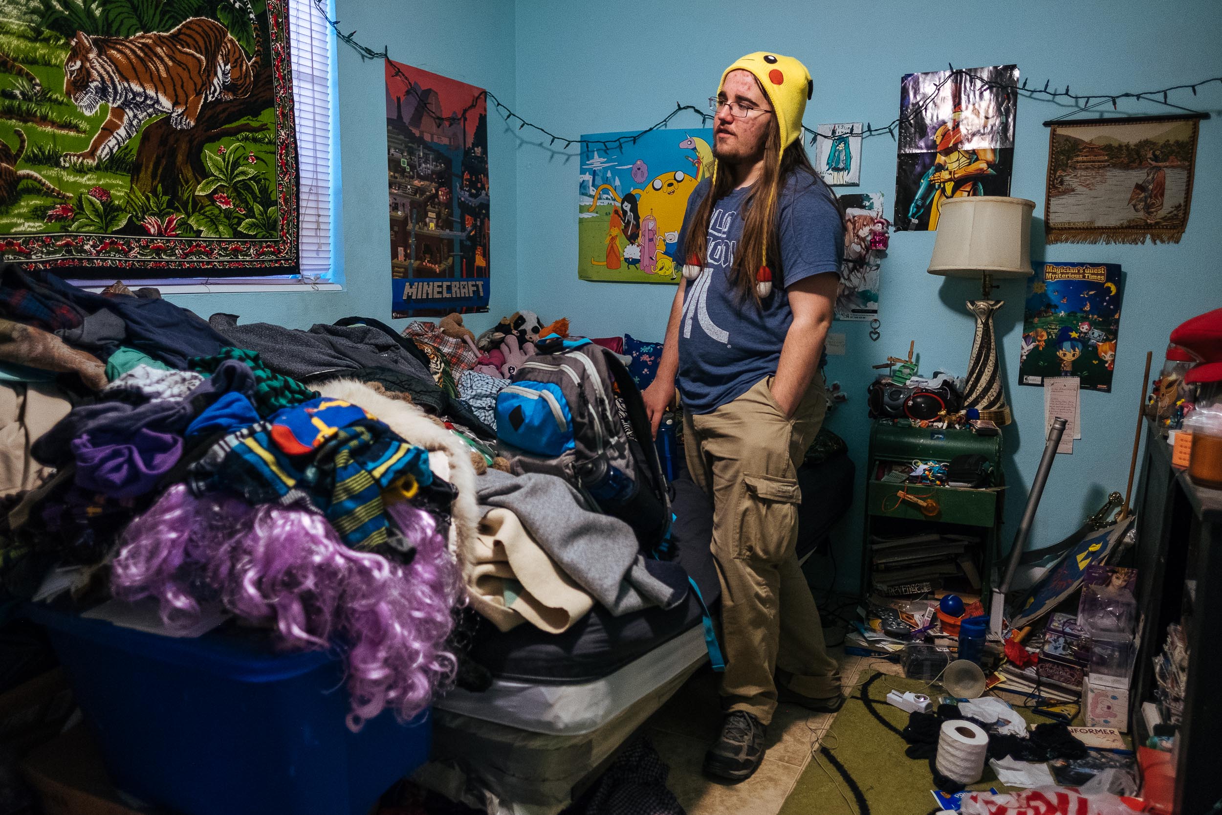 Jenny's son, Zefram, in his bedroom. Zefram is a senior in high school. Despite requiring some special attention scholastically and needing help with navigating change, Jenny describes Zefram as smart and funny. She says Zefram is a good person and that makes her a good mom. 