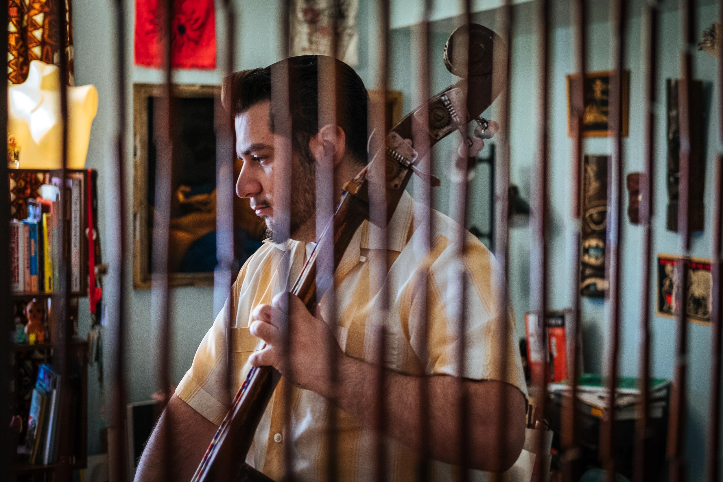  Johnny practices the upright bass while listening to a vintage rockabilly record.&nbsp; 