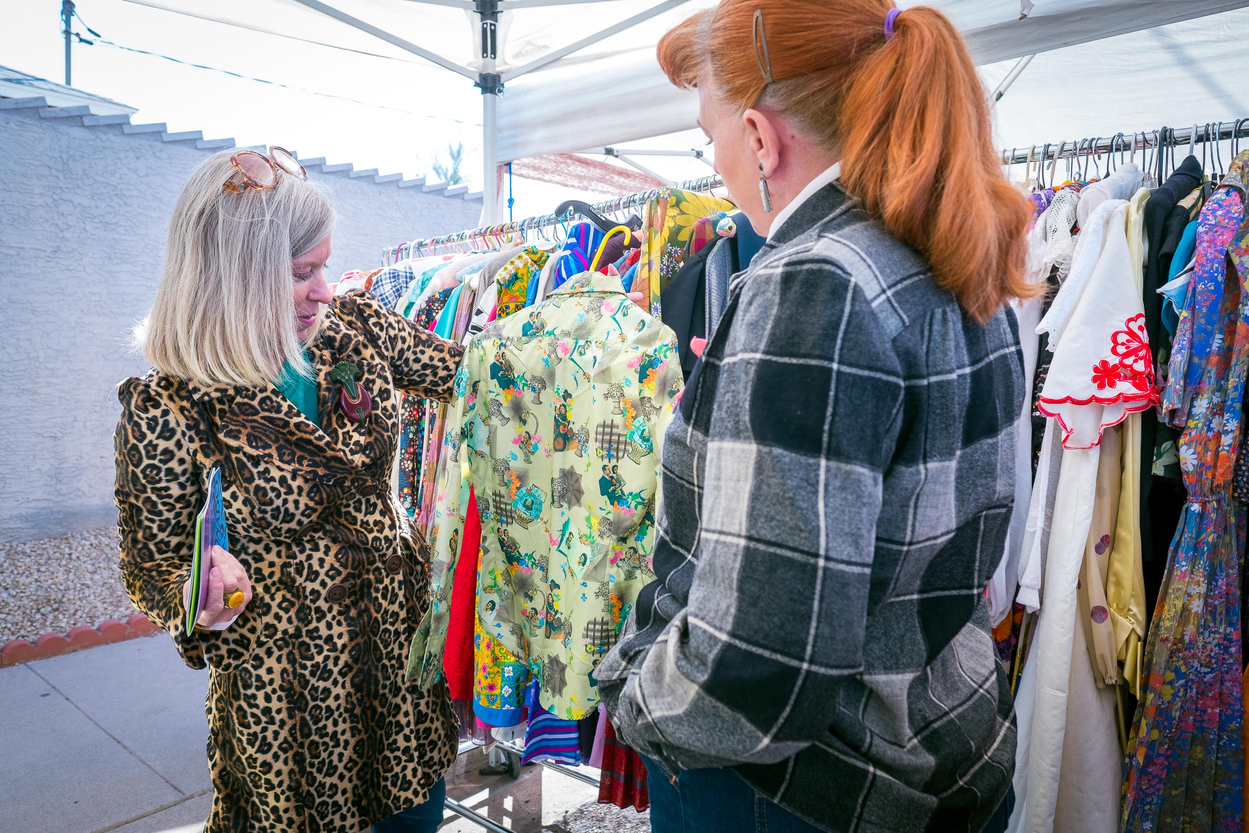  Jenny shows off a vintage shirt during a sale &nbsp;at the Coronado Home Tour. Jenny cherishes &nbsp;the rapport and realationships she has with her customers.&nbsp; 