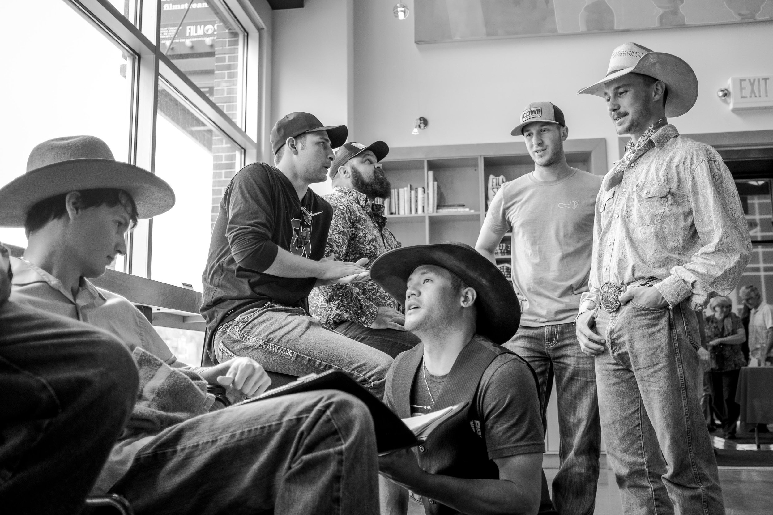  Lane Scott (far left) and Brady Jandreau (far right) catch up with rodeo friends before the screening of The Rider.  