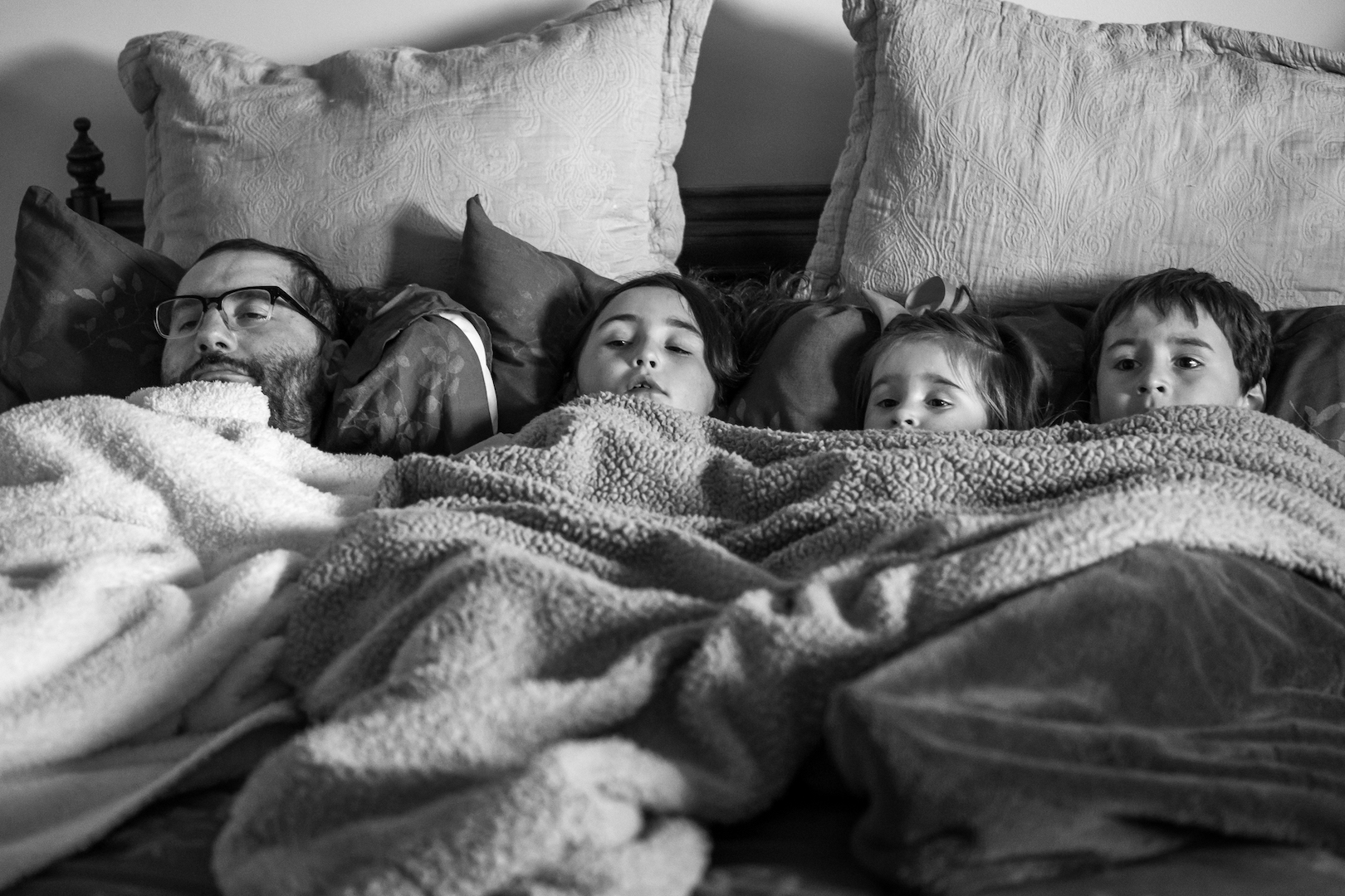  Mike and his children enjoying a movie during a weekend home visit. 