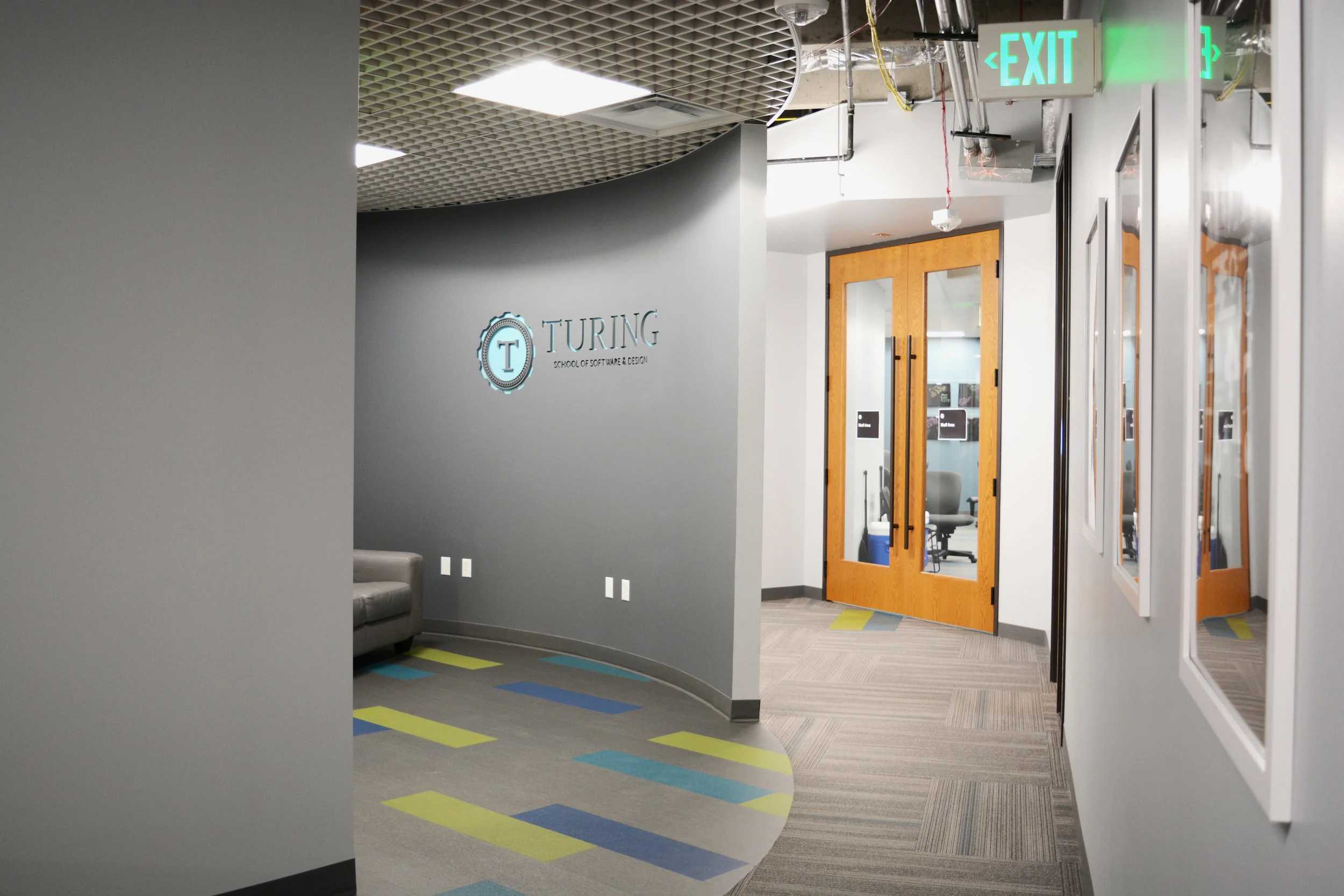 While the space required a devoted entry area, Turing does not operate with a receptionist. We created an interesting entry without dedicating a significant amount of square footage. Patcraft’s Mixed Materials Metallix LVT flooring and Armstrong’s MetalWorks Open Cell ceiling create multiple colors and textures for a big impact without big sacrifice of area.