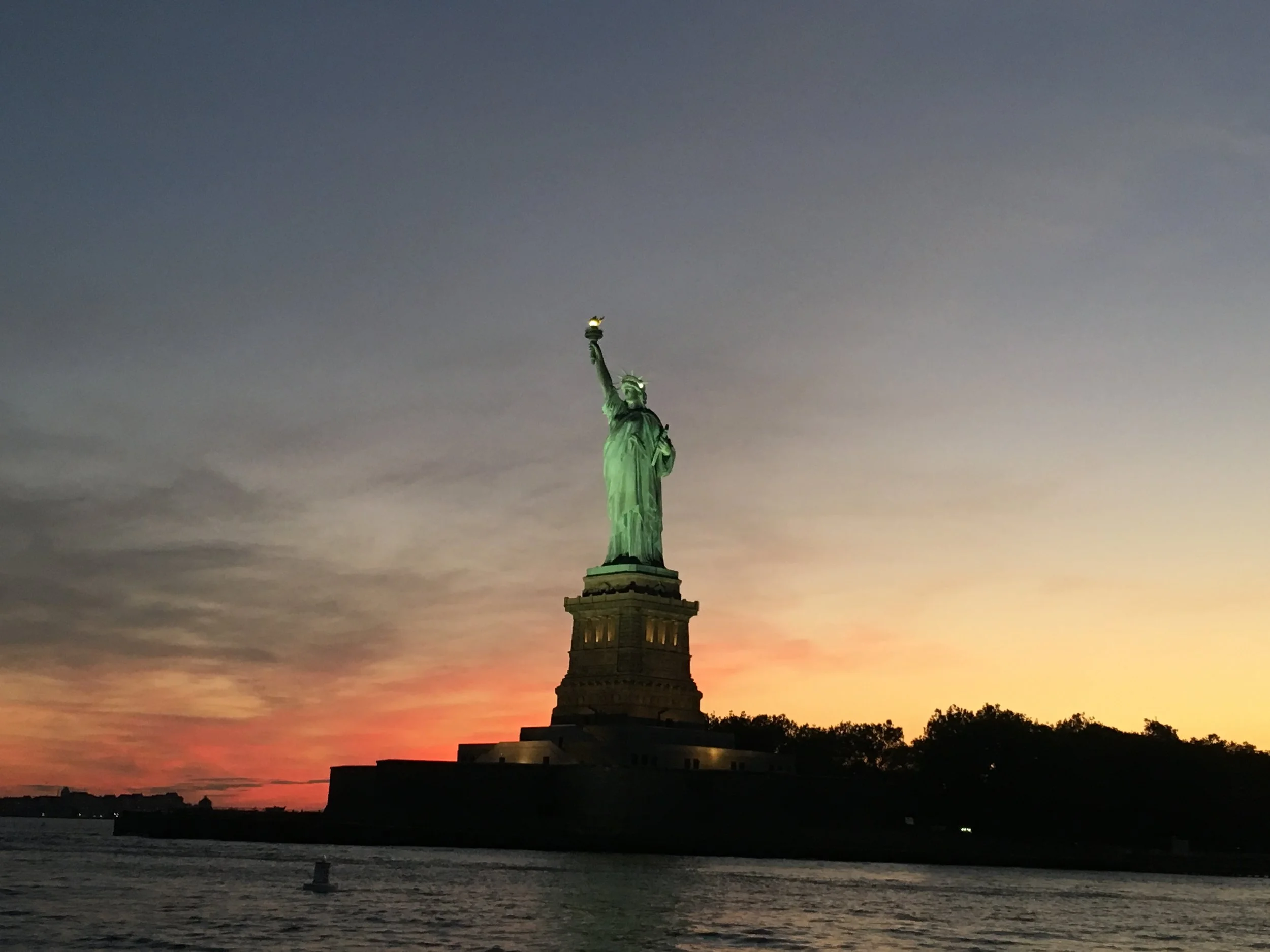 The Statue of Liberty at sunset.