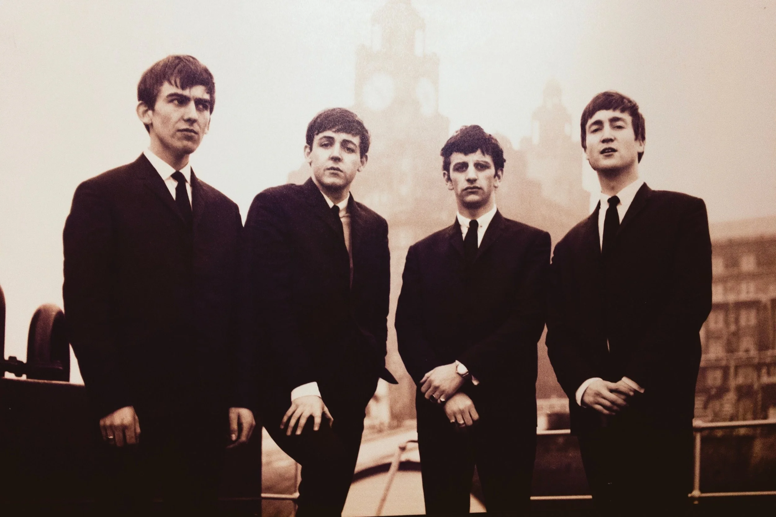 The Beatles looking dapper and kinda serious.