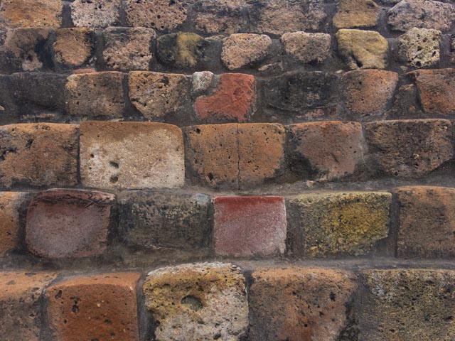 Stone colors from different regions brought to build the pyramid and surrounding structures.