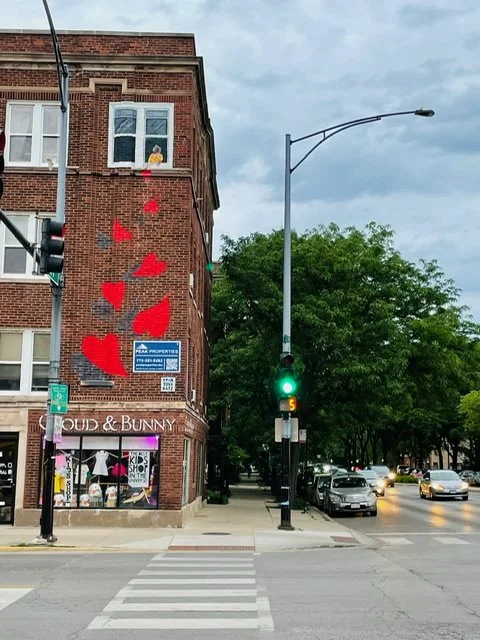 "Elliott's Hearts" exterior mural on brick wall by Ryan Tova Katz.