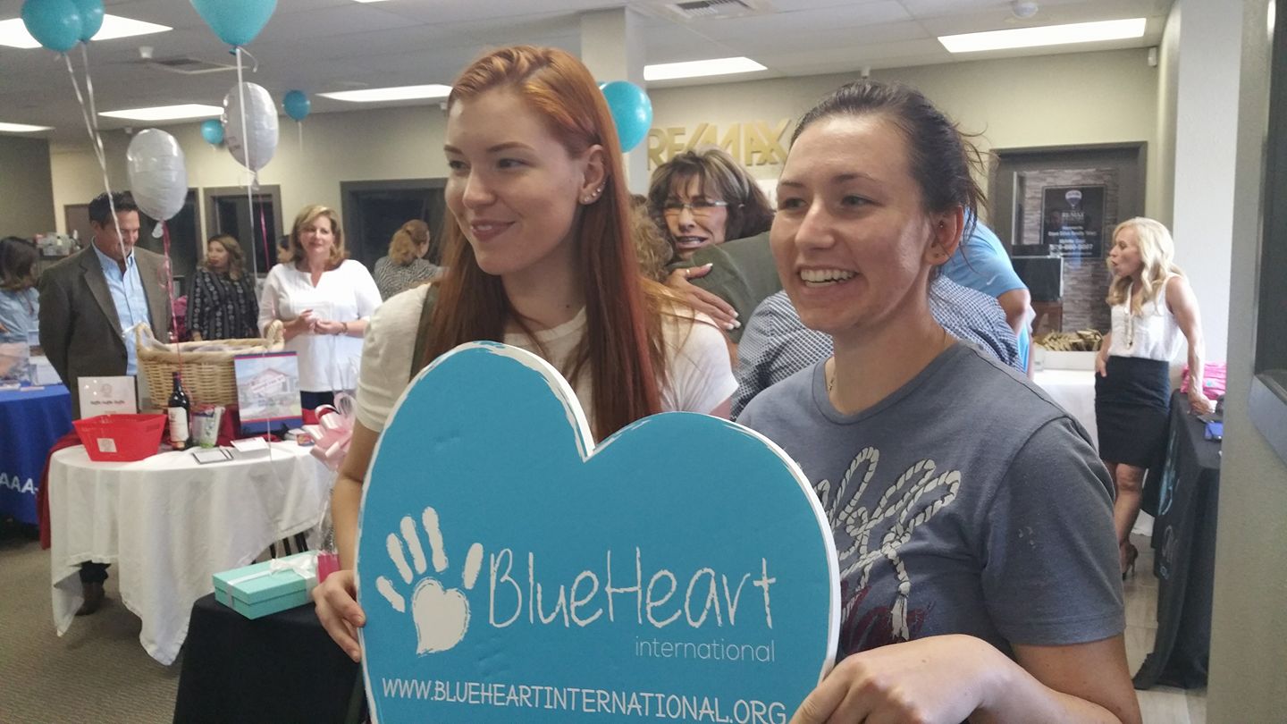 Katelyn and Karley volunteering with one of Terry's favorite nonprofits, Blue Heart International.