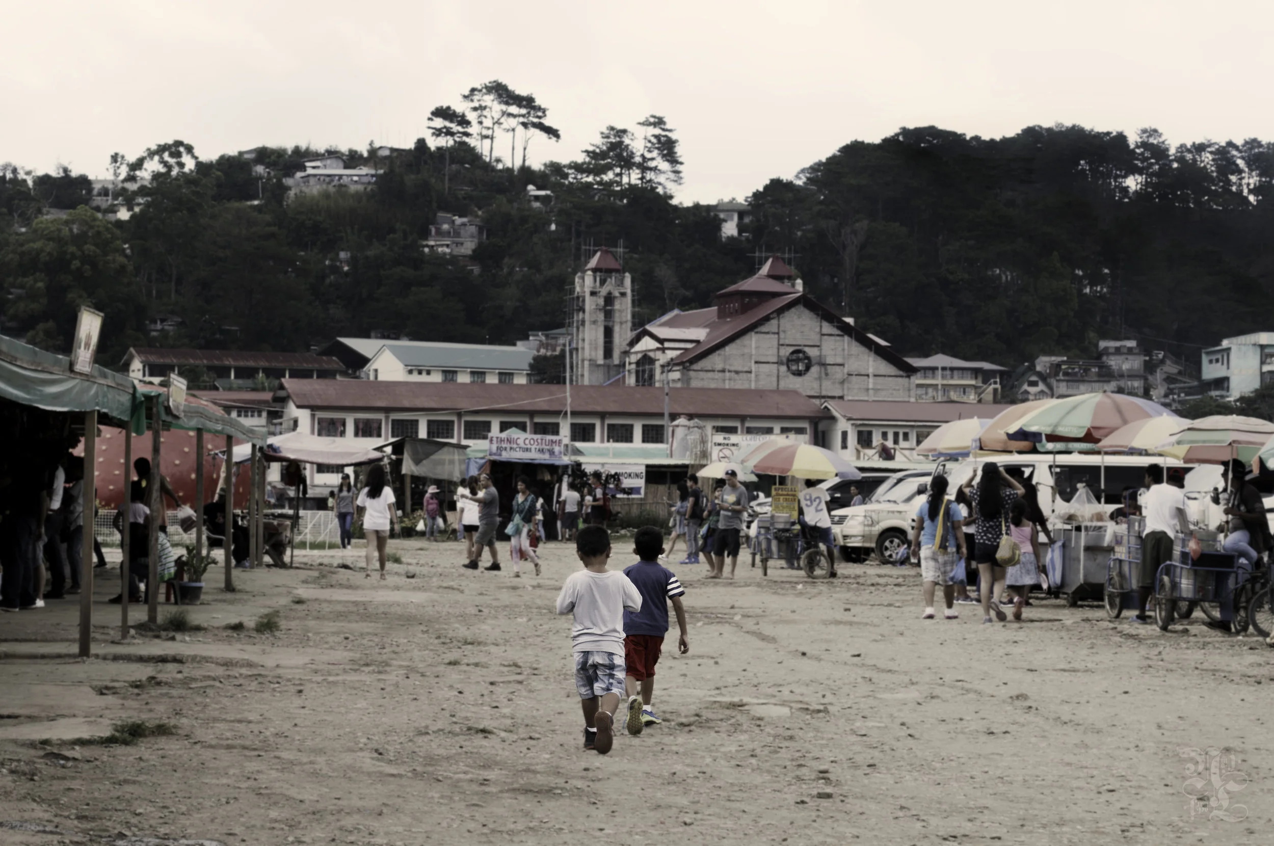 Two young boys strolling the marketplace