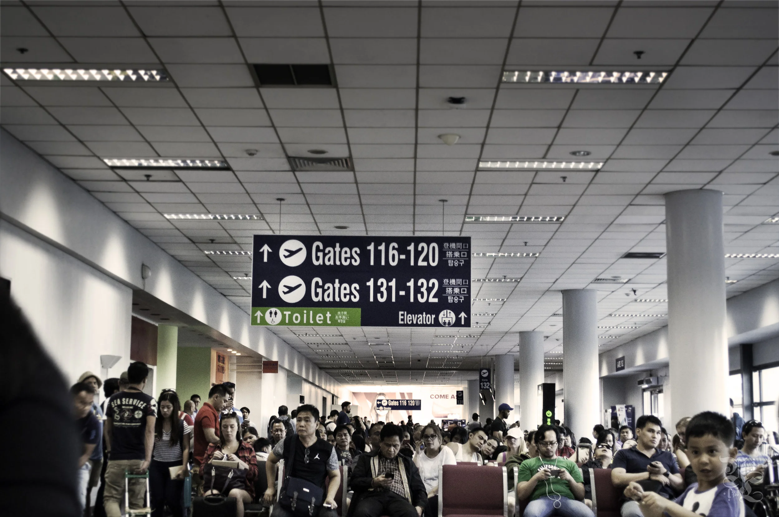 People crowding the NAIA domestic terminal after 4hr+ flight delays