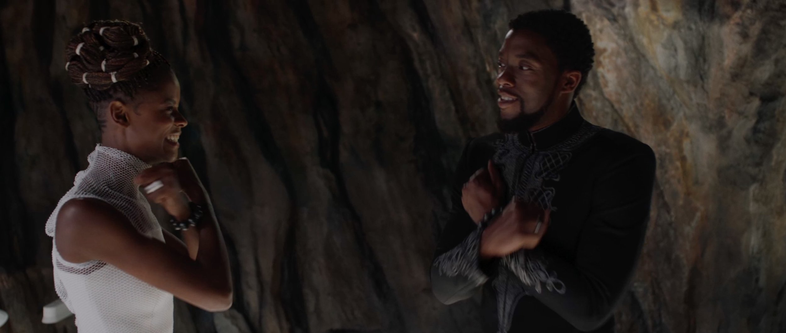 In the trailer the Wakanda salute and handshake are in reverse order of the film version. In the trailer the order feels like escalation, but in the film the scene indicates the salute is a formality, but T'Challa and Shuri have a more informal relationship.