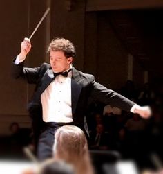 Conductor Alan Buxbaum leads the orchestra in a robust program of both classical and movie classics.