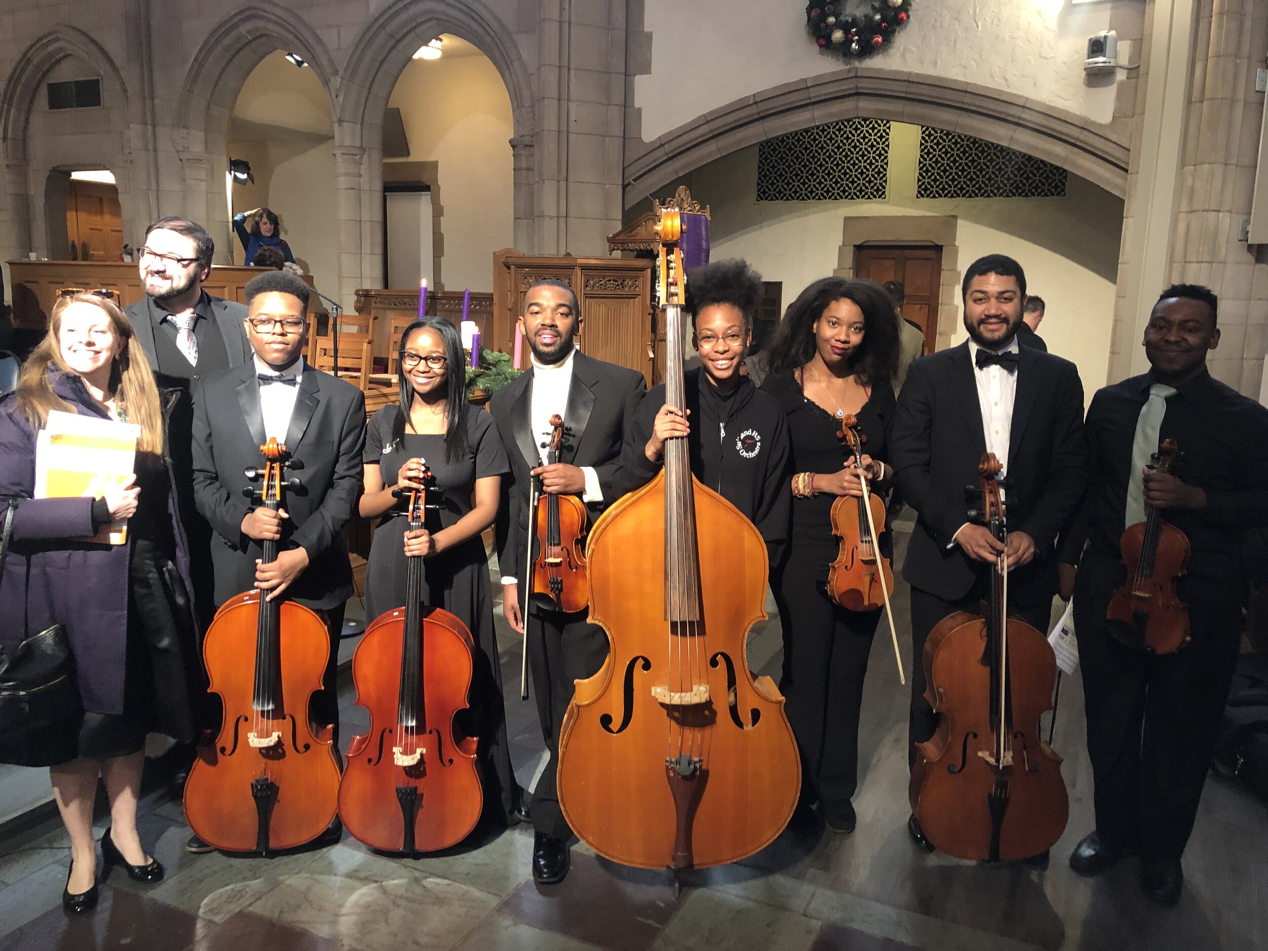 Members of the Messiah Chamber Orchestra, a project of DC Strings Workshop celebrate concerts in the Tenleytown neighborhood of DC.