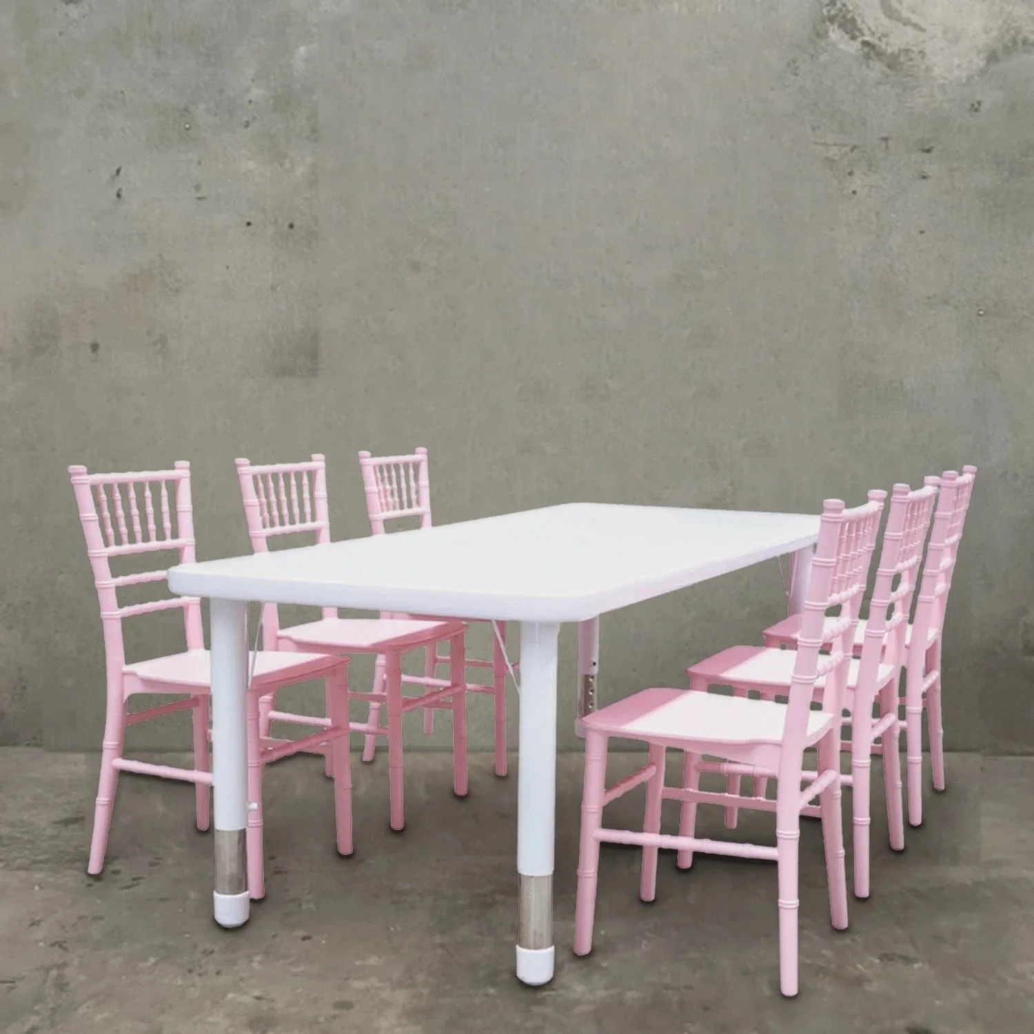 Kids white table with six pink tiffany chairs for hire