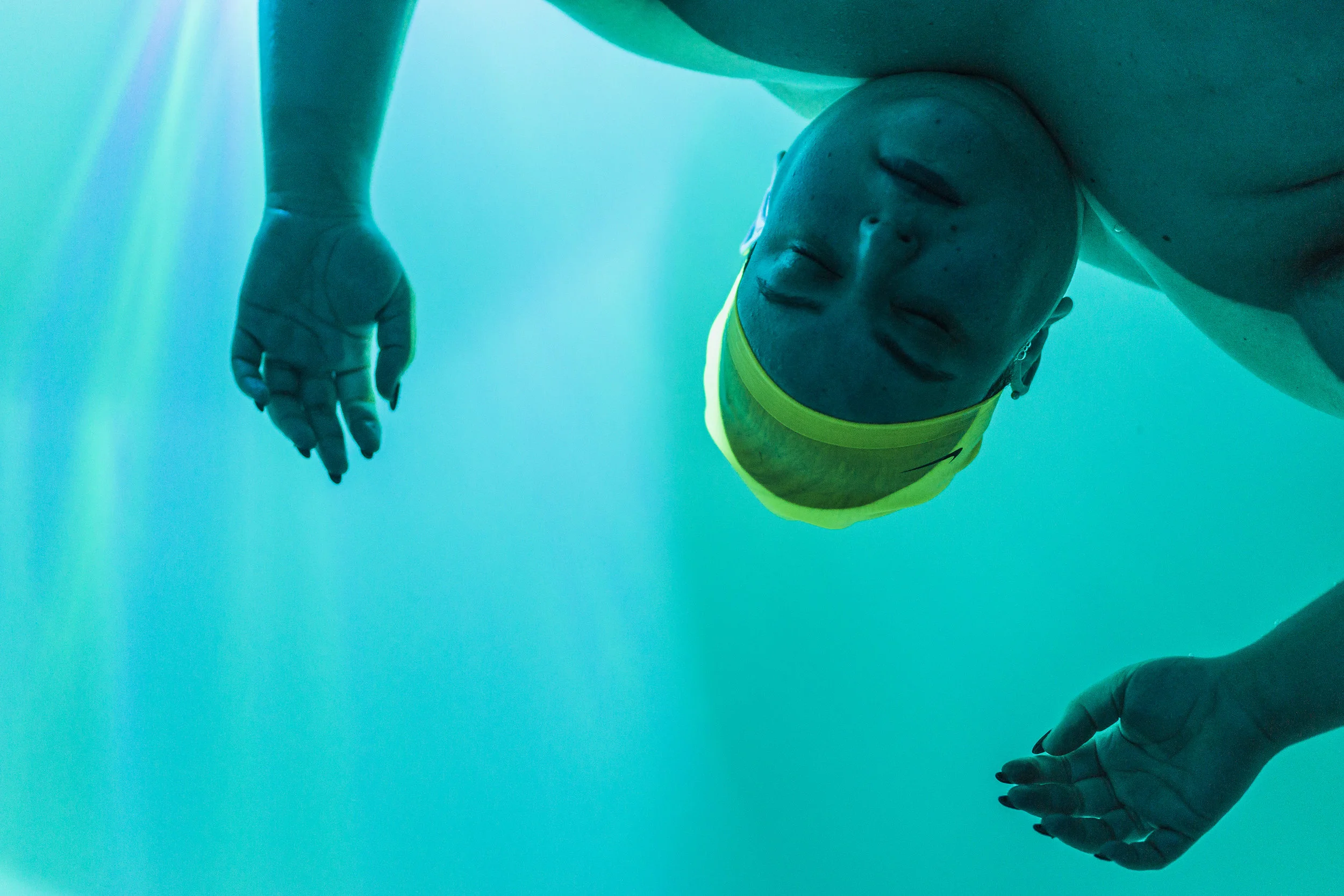Because my hair is dyed, I wear a swim cap while I float. It's to protect the water from any potential dye runoff.