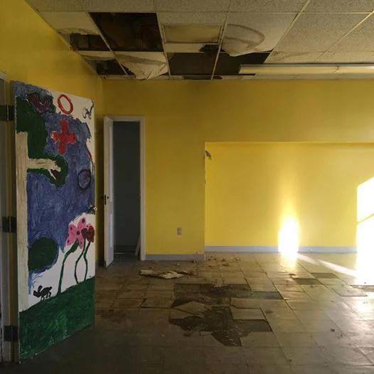 Before: Water damage to ceiling and floor.